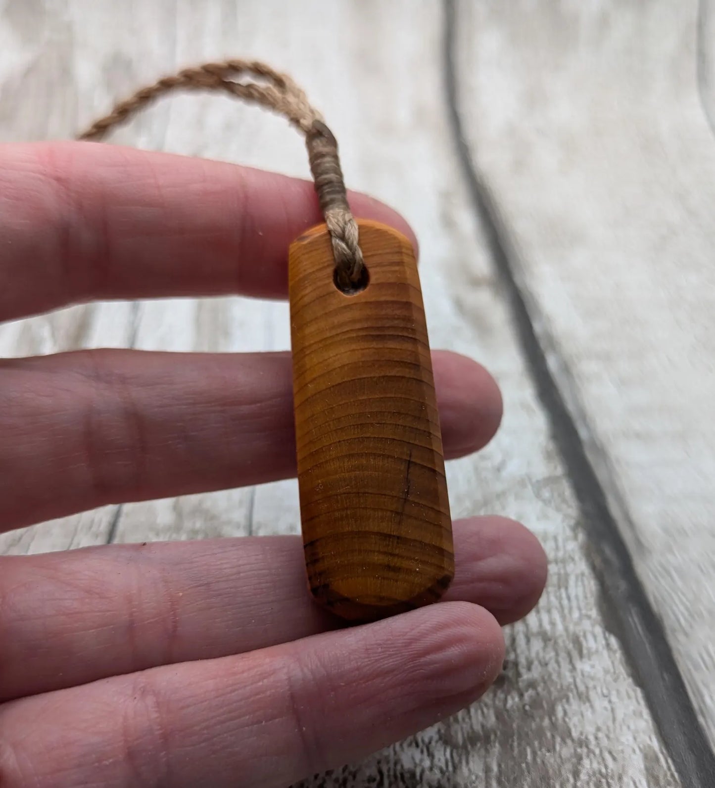 Yew wood roimata drop pendant.