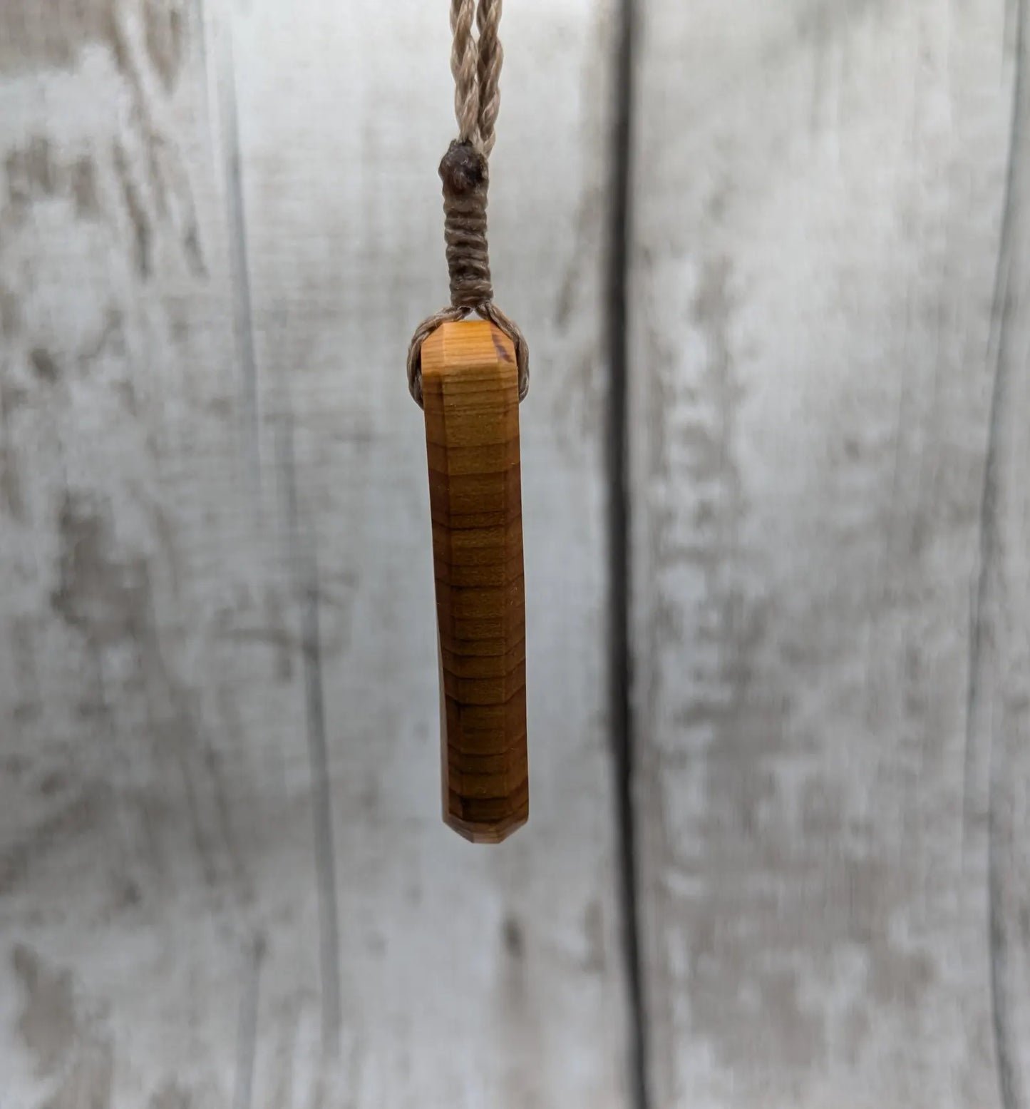 Yew wood roimata drop pendant.