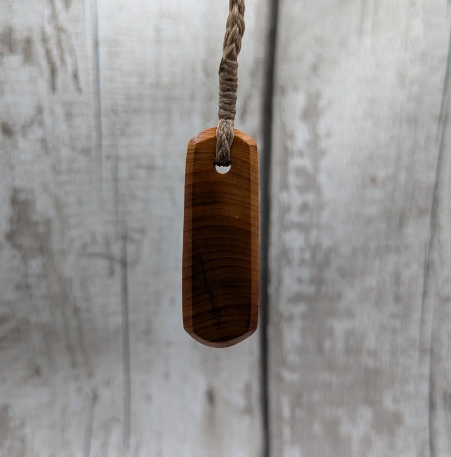 Yew wood roimata drop pendant.