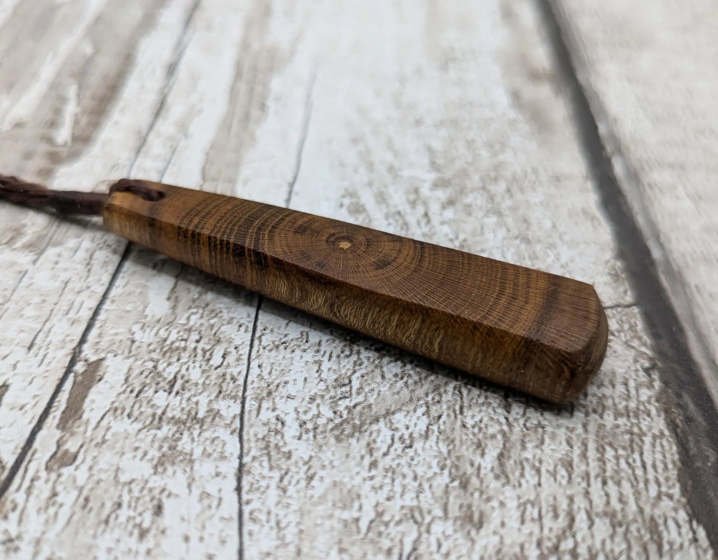 Laburnum wood roimata teardrop carved pendant.