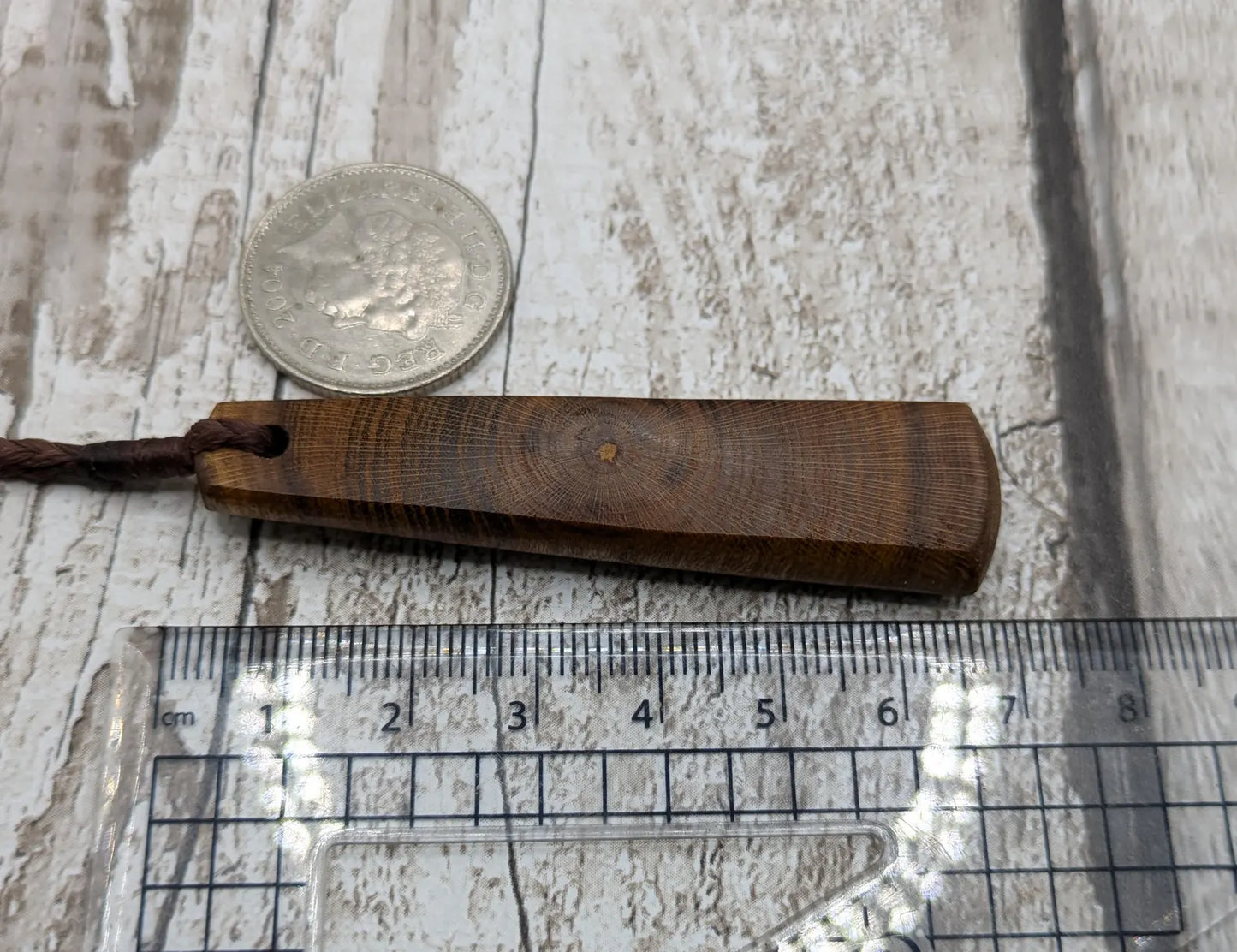 Laburnum wood roimata teardrop carved pendant.