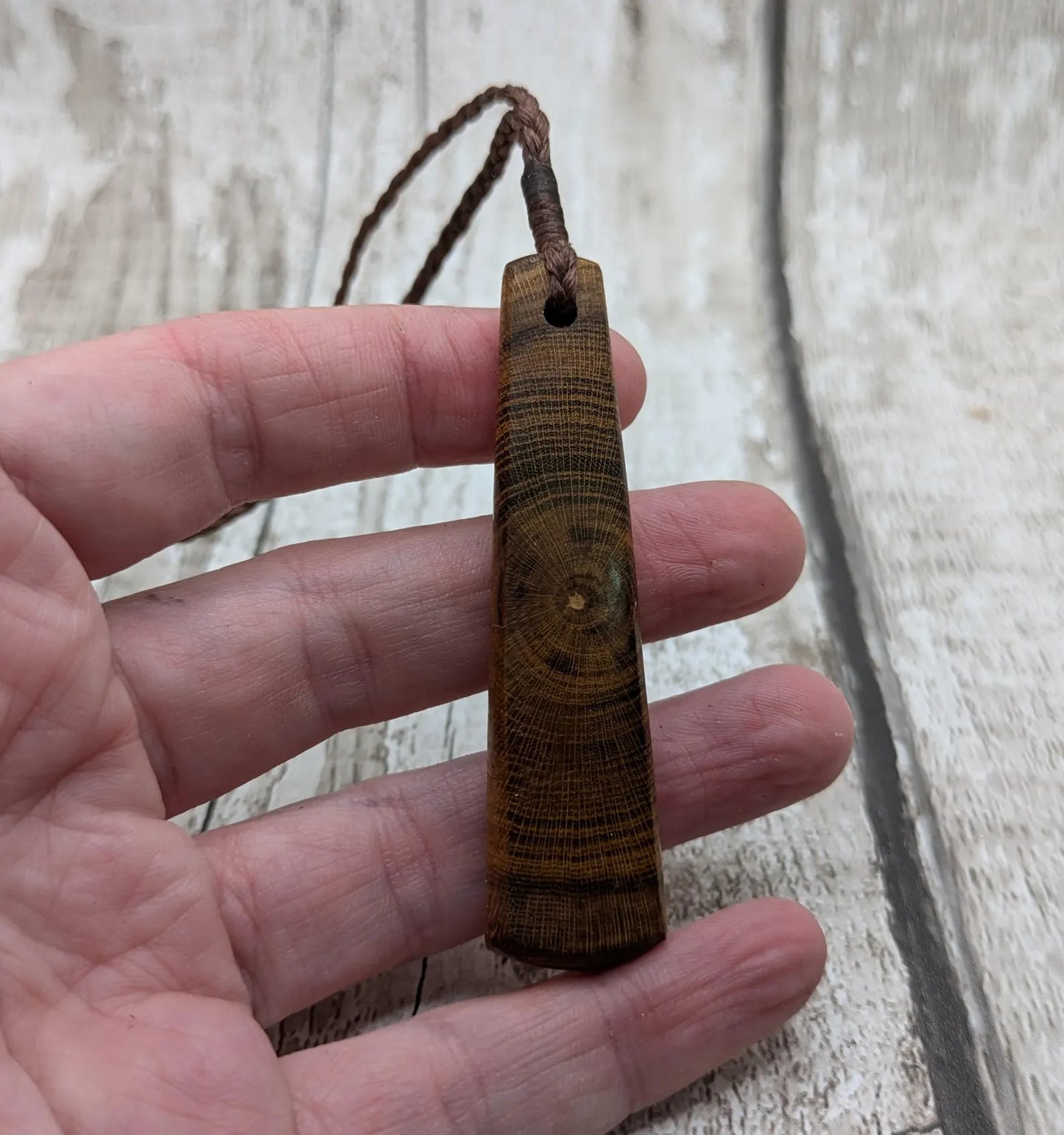 Laburnum wood roimata teardrop carved pendant.