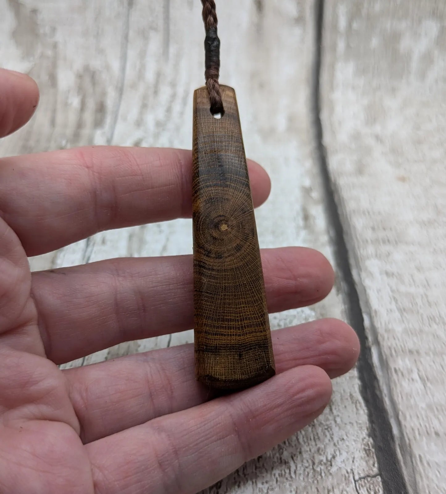 Laburnum wood roimata teardrop carved pendant.