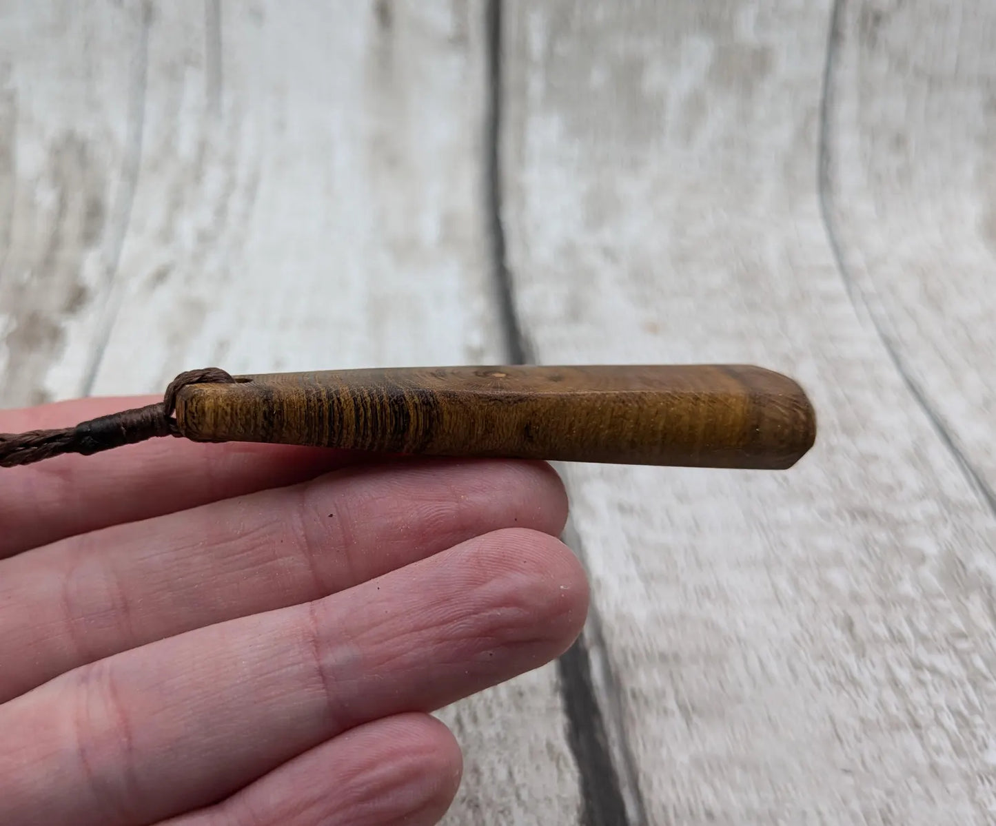 Laburnum wood roimata teardrop carved pendant.