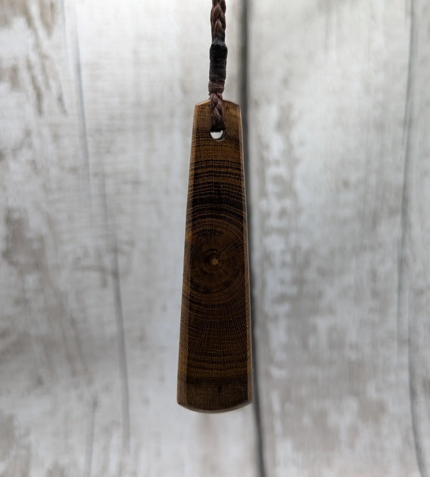 Laburnum wood roimata teardrop carved pendant.