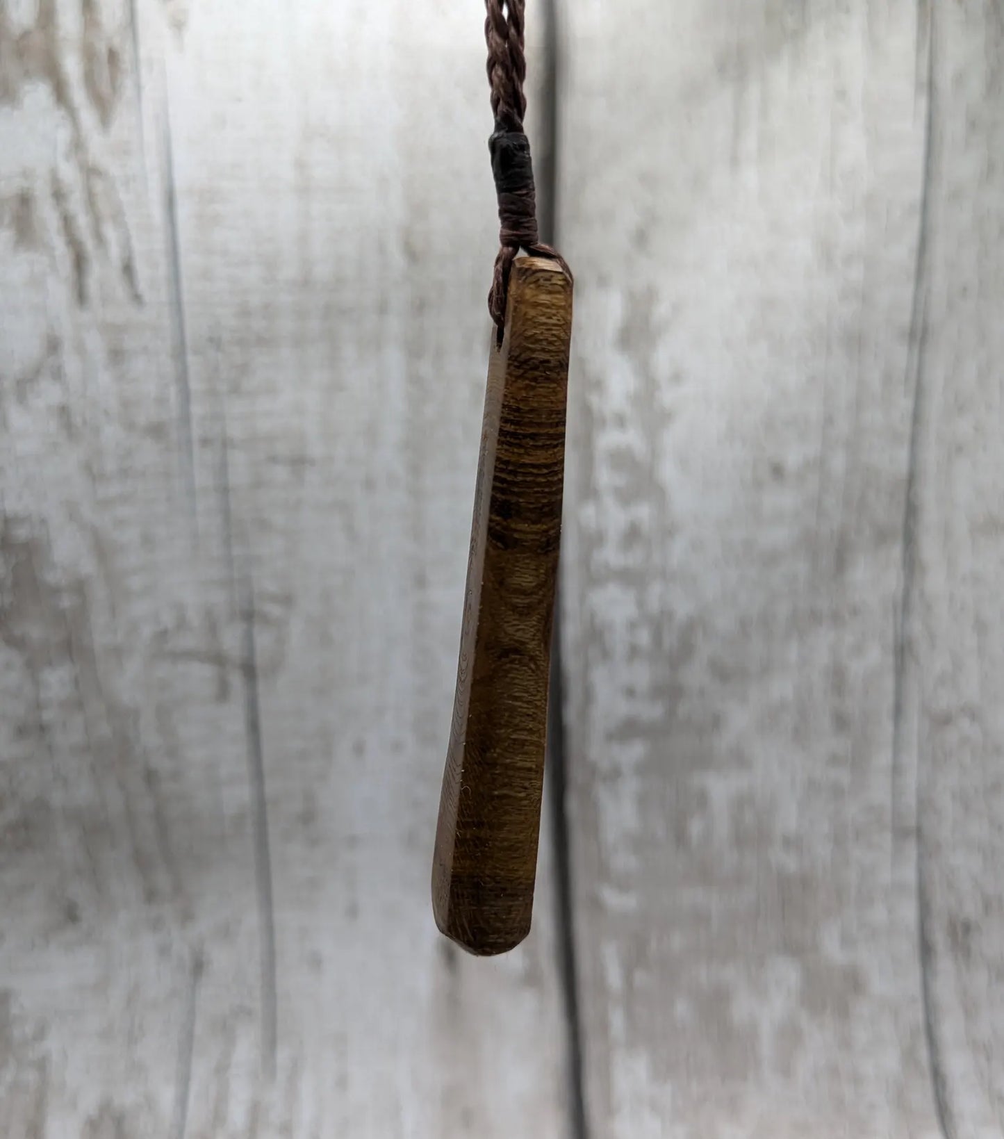 Laburnum wood roimata teardrop carved pendant.