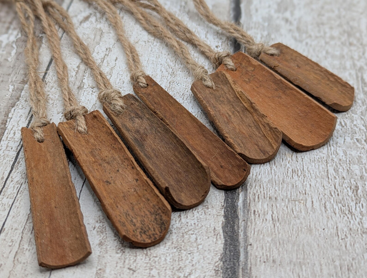 6 pack small cinnamon bark seasonal hanging decorations.