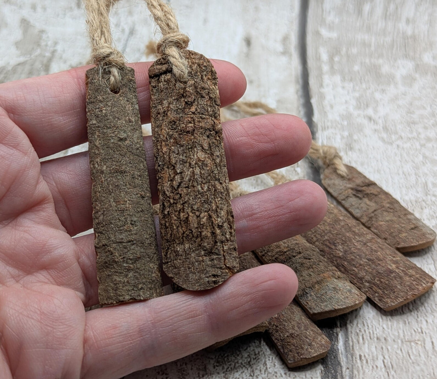 6 pack small cinnamon bark seasonal hanging decorations.