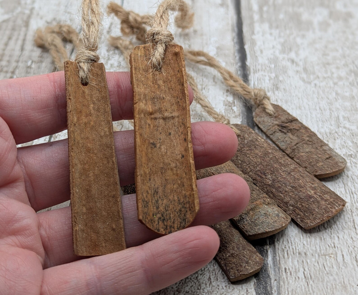 6 pack small cinnamon bark seasonal hanging decorations.