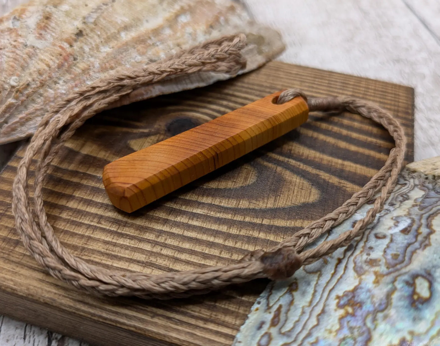 Yew wood roimata drop pendant.