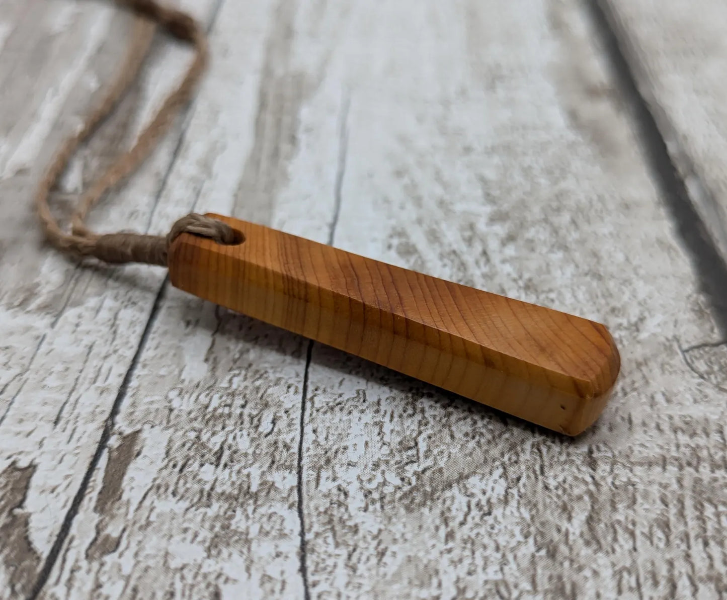 Yew wood roimata drop pendant.