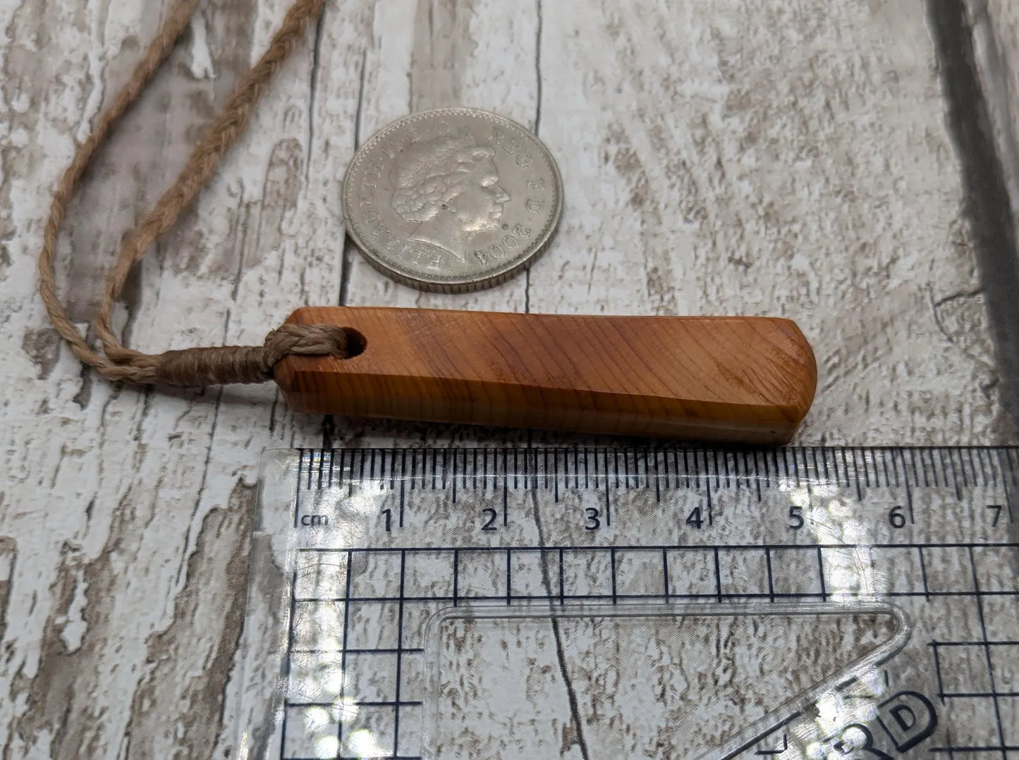 Yew wood roimata drop pendant.