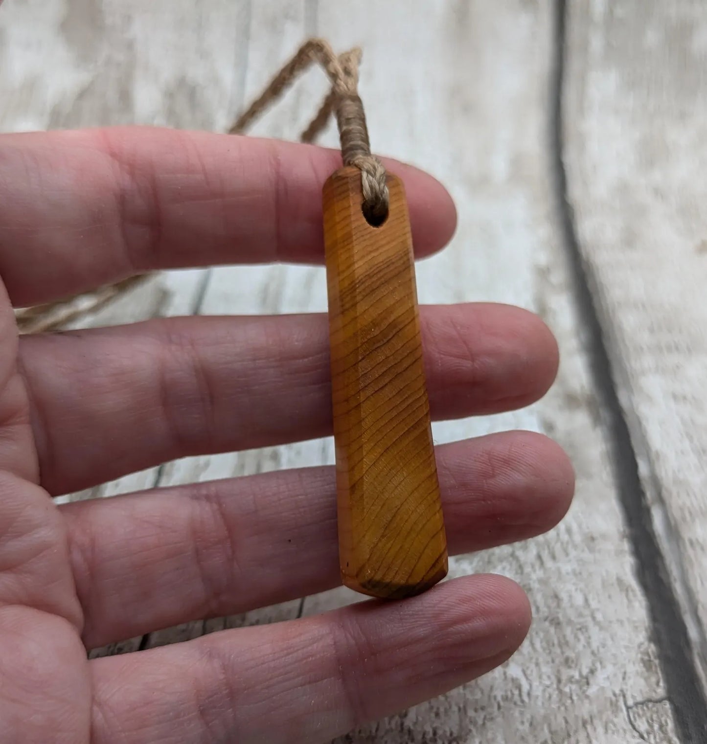 Yew wood roimata drop pendant.