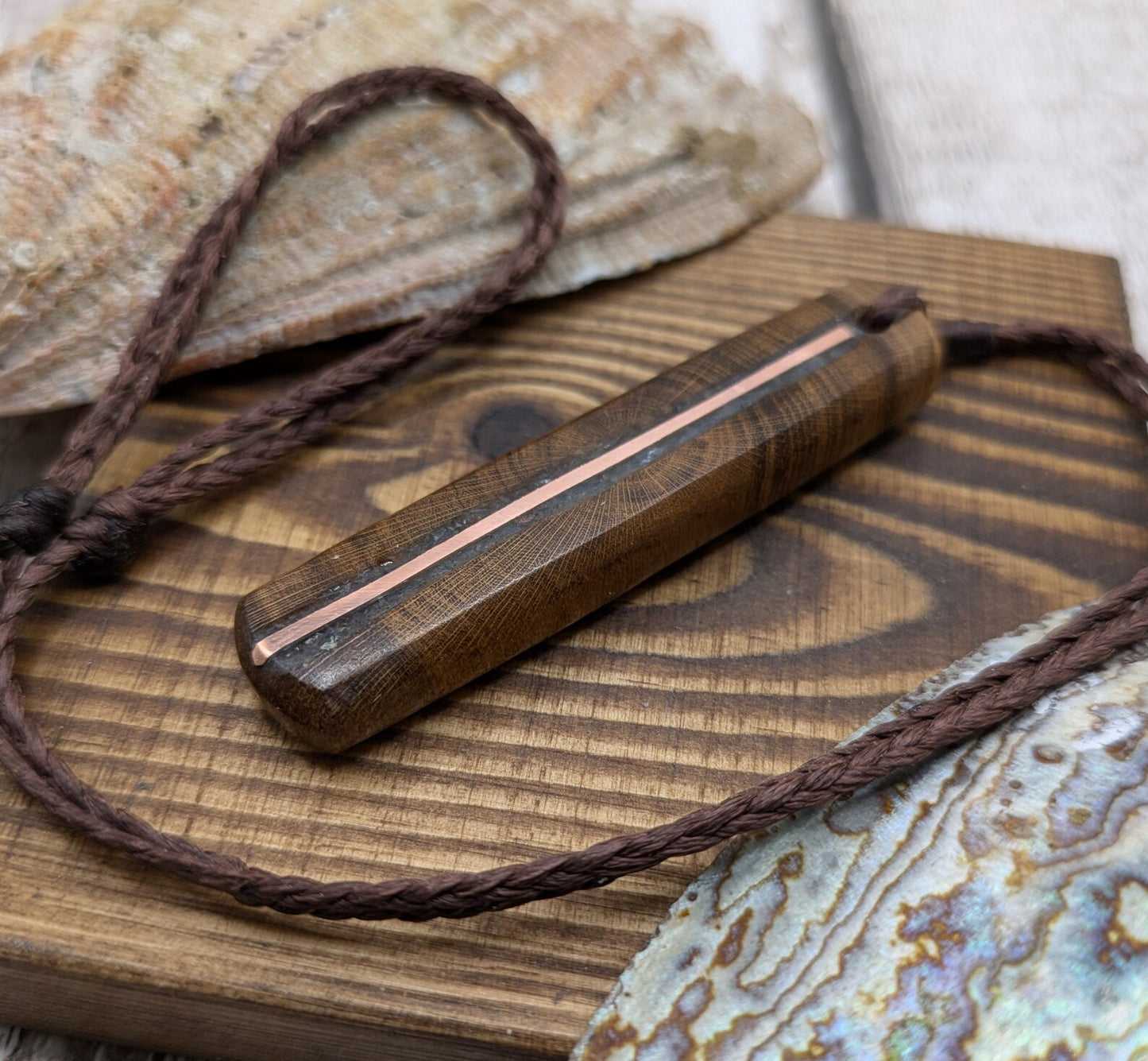 Laburnum wood roimata tear drop pendant with copper and blue kyanite.