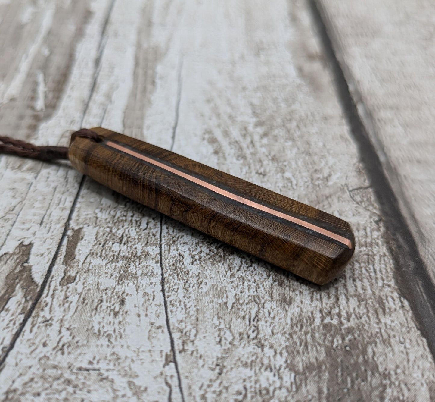 Laburnum wood roimata tear drop pendant with copper and blue kyanite.