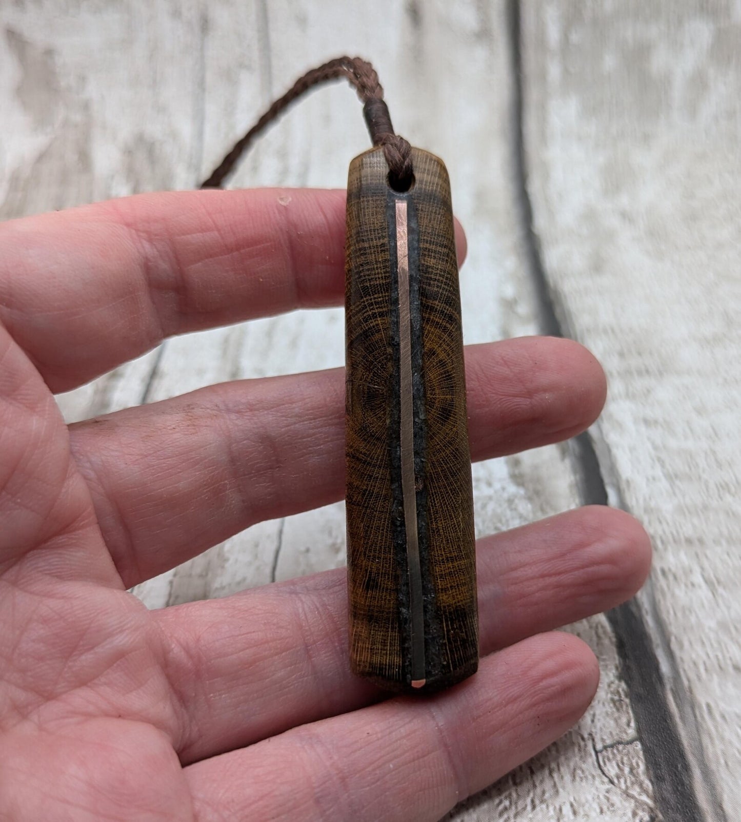 Laburnum wood roimata tear drop pendant with copper and blue kyanite.