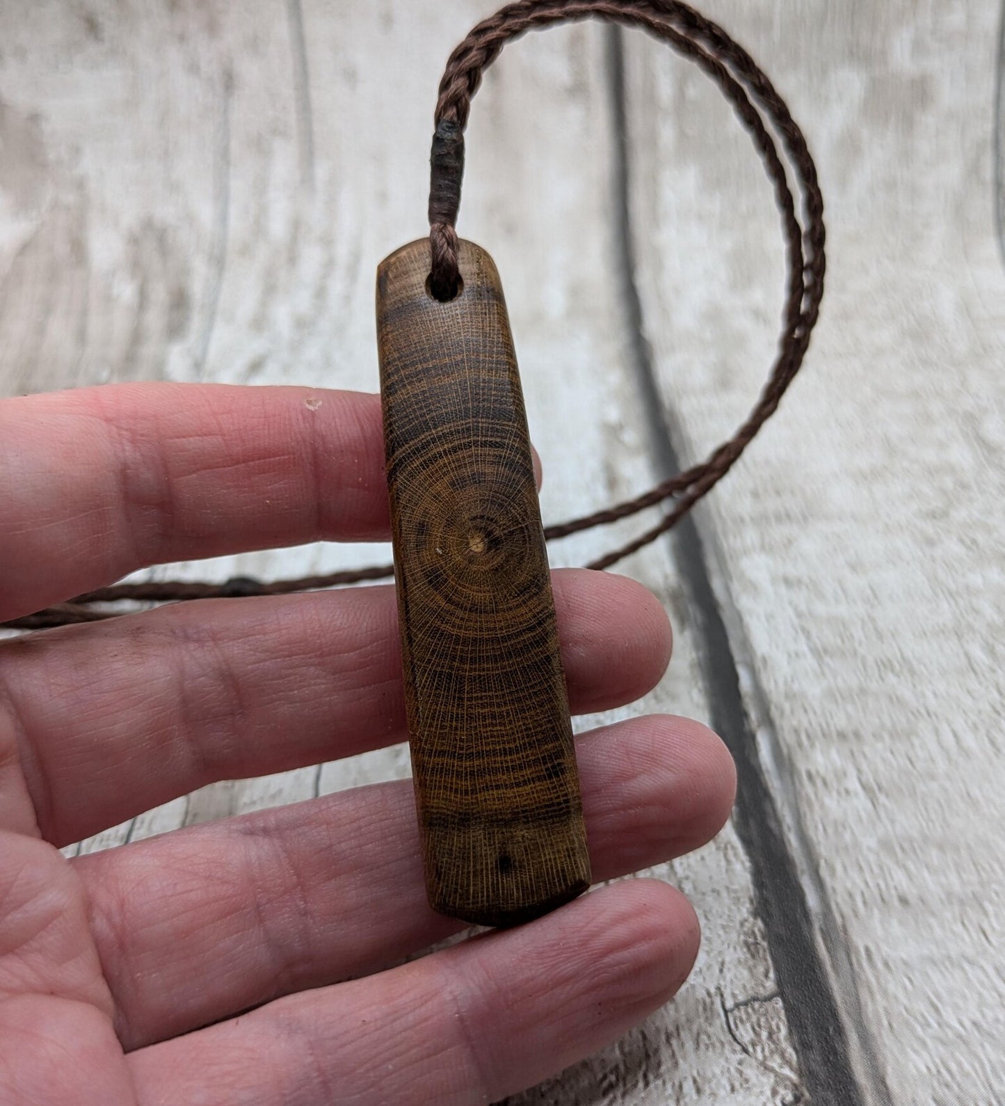 Laburnum wood roimata tear drop pendant with copper and blue kyanite.