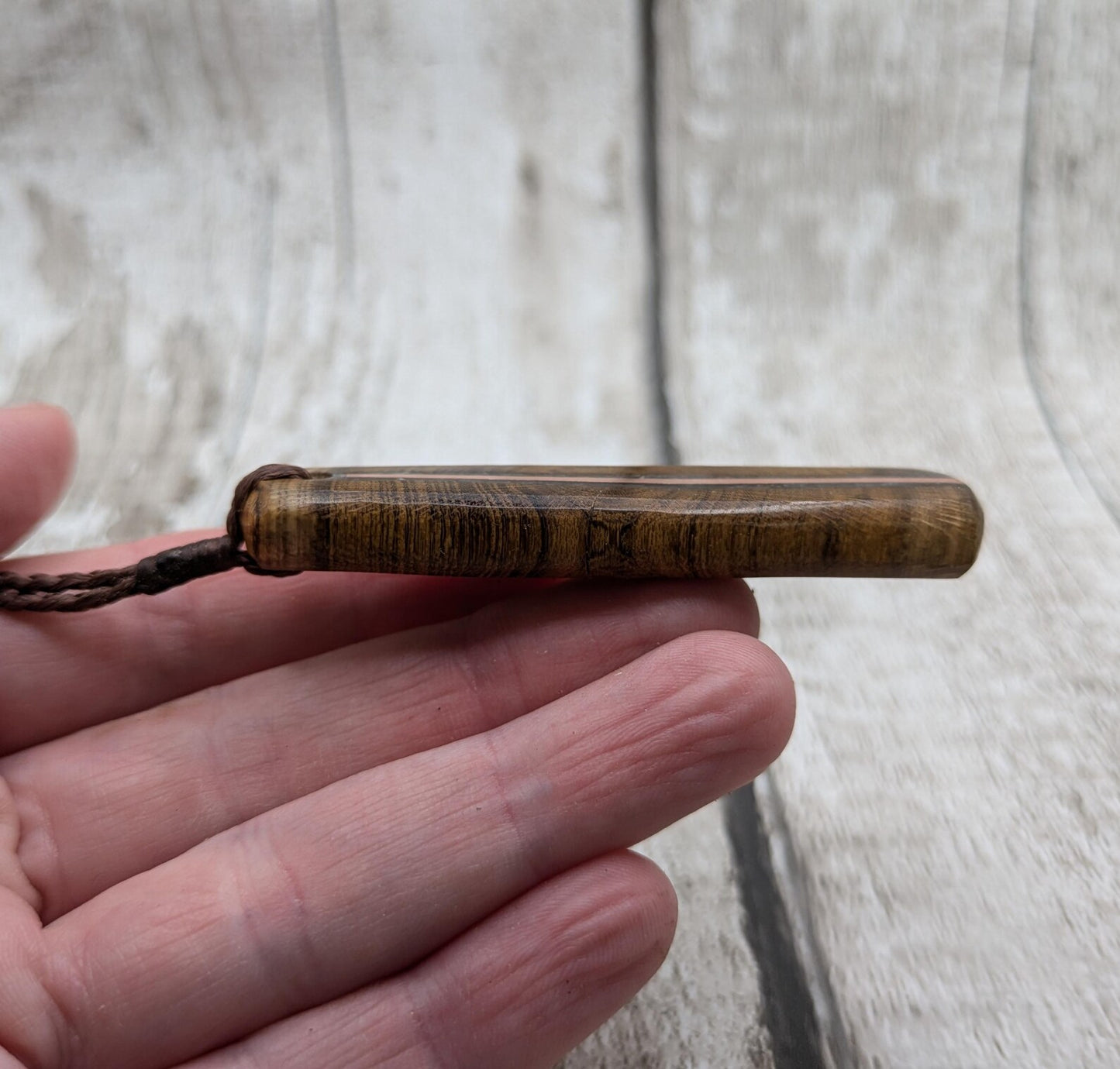 Laburnum wood roimata tear drop pendant with copper and blue kyanite.