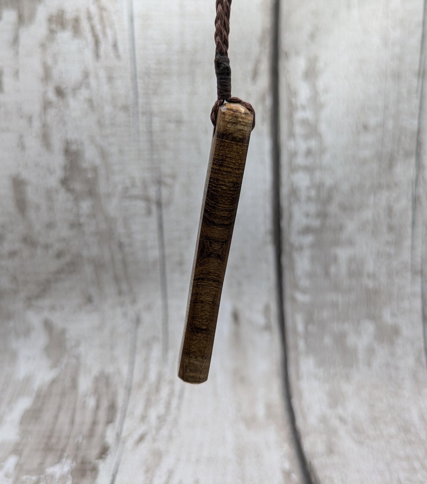 Laburnum wood roimata tear drop pendant with copper and blue kyanite.