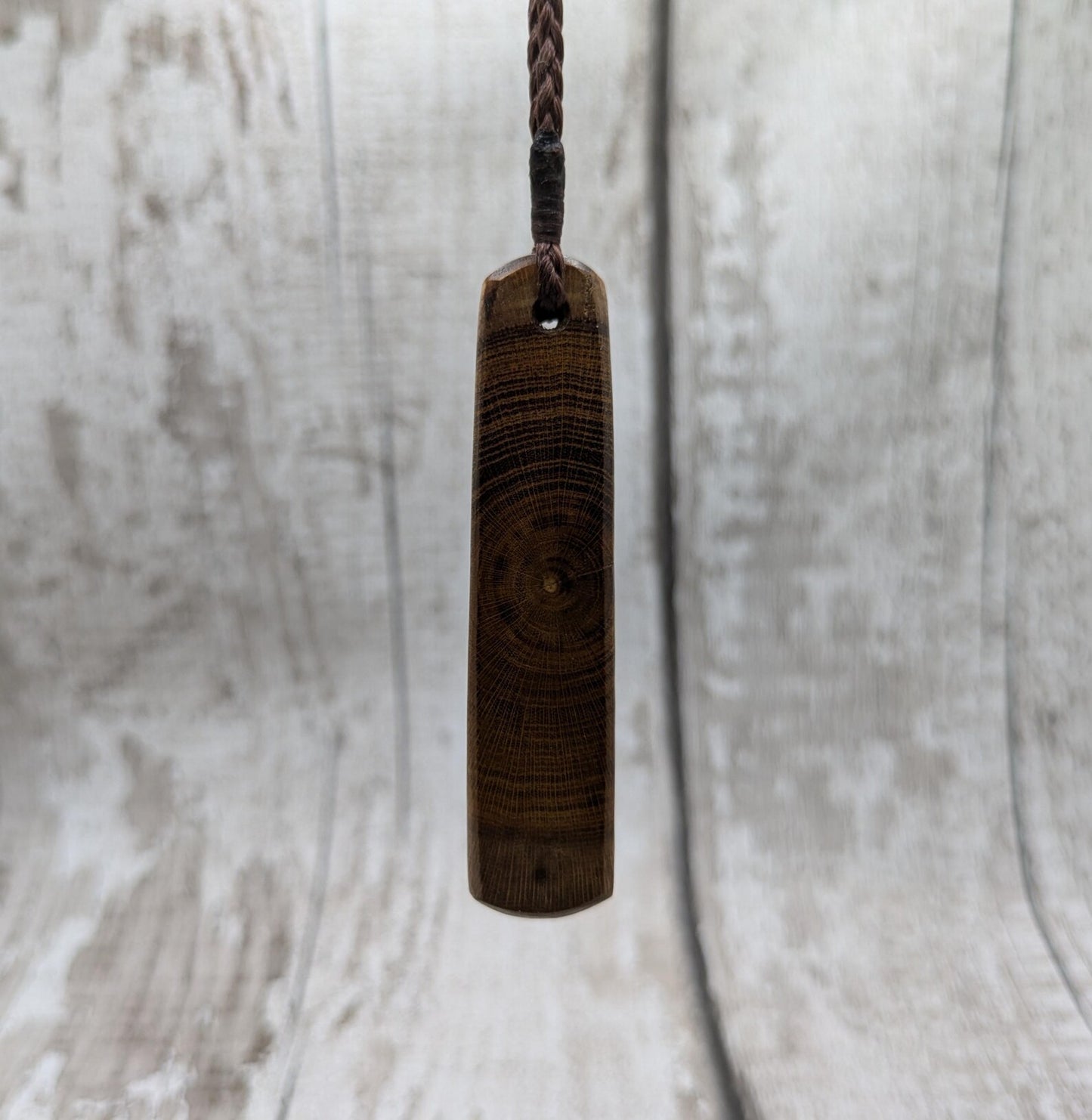 Laburnum wood roimata tear drop pendant with copper and blue kyanite.