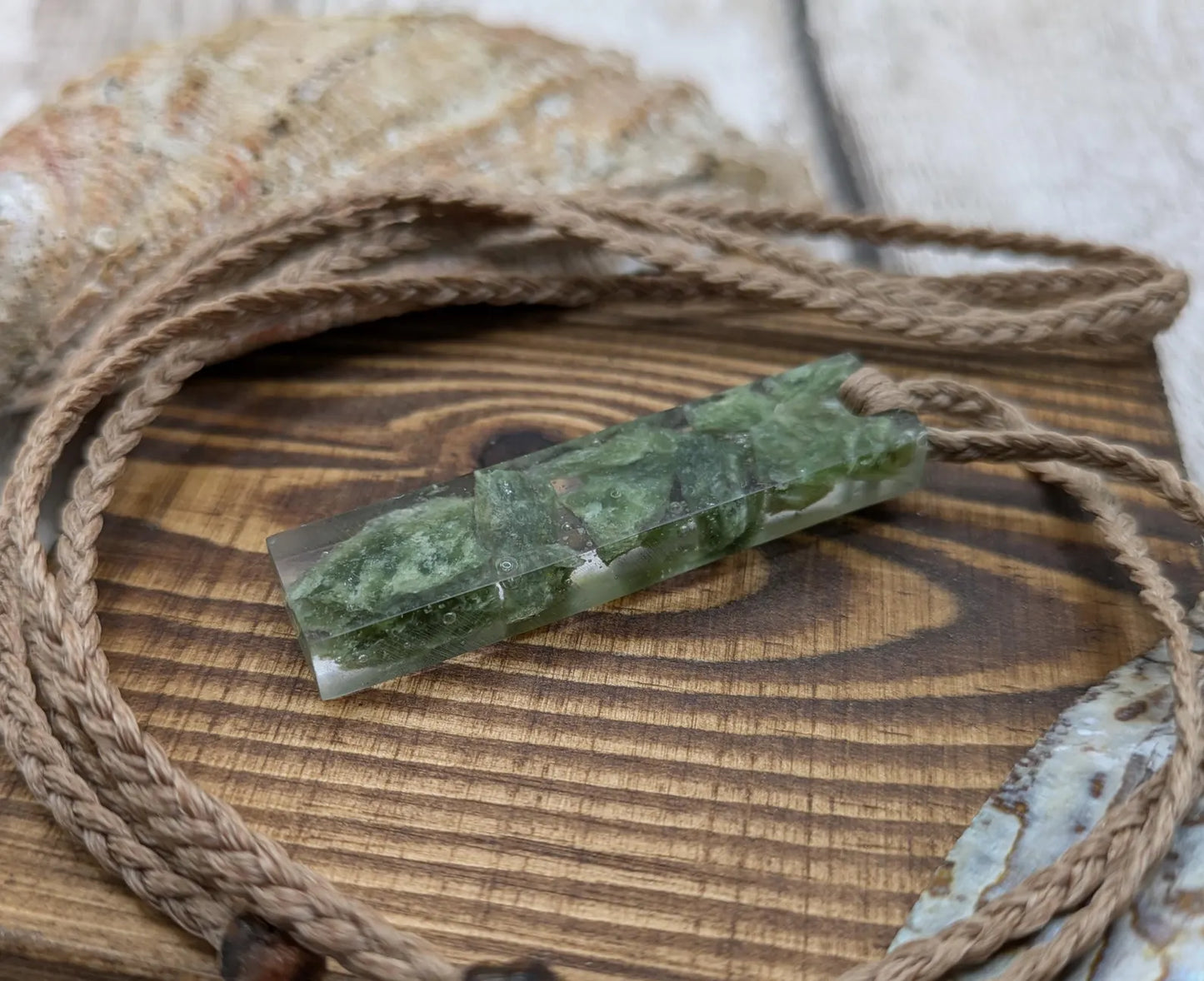 Alaskan jade in resin pendant.