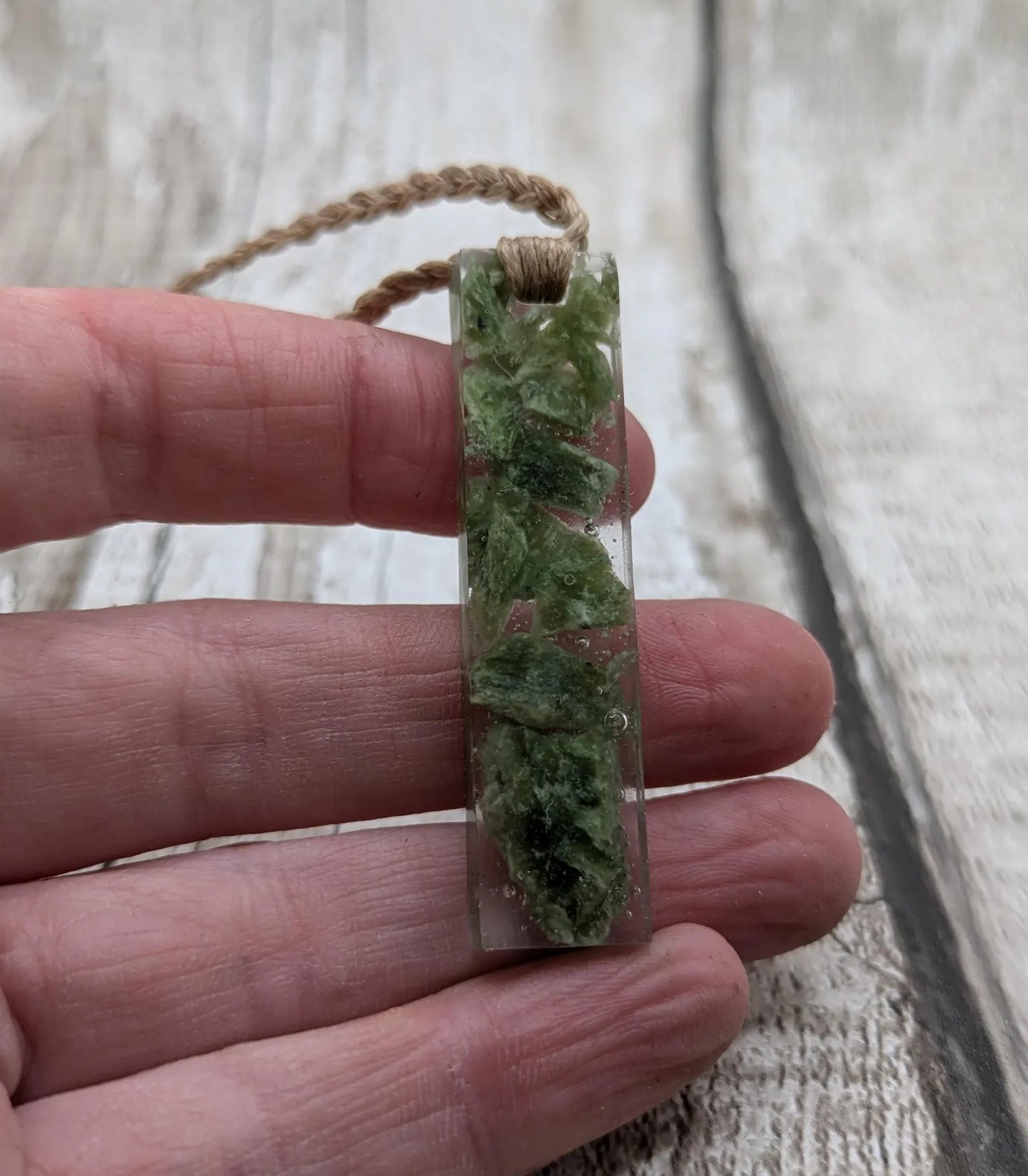 Alaskan jade in resin pendant.