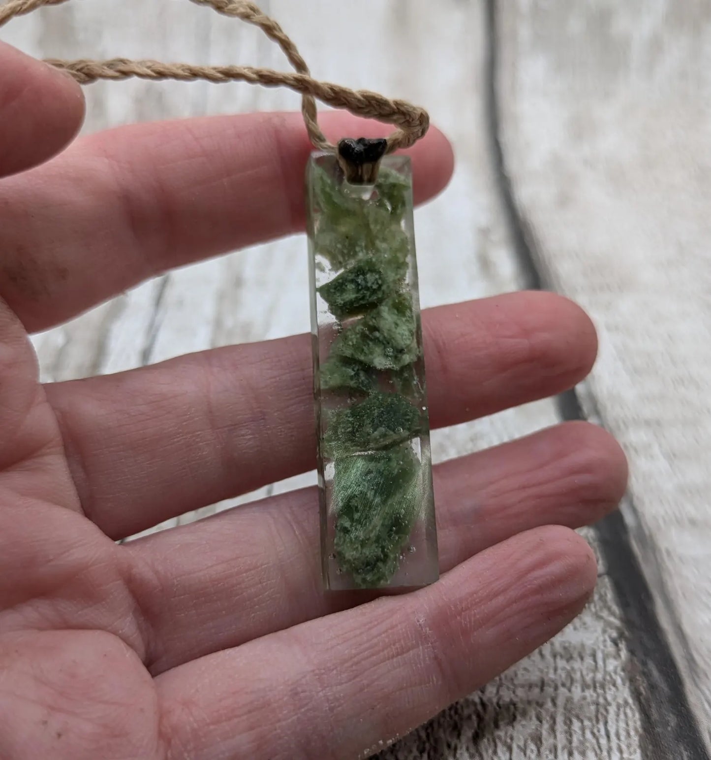 Alaskan jade in resin pendant.