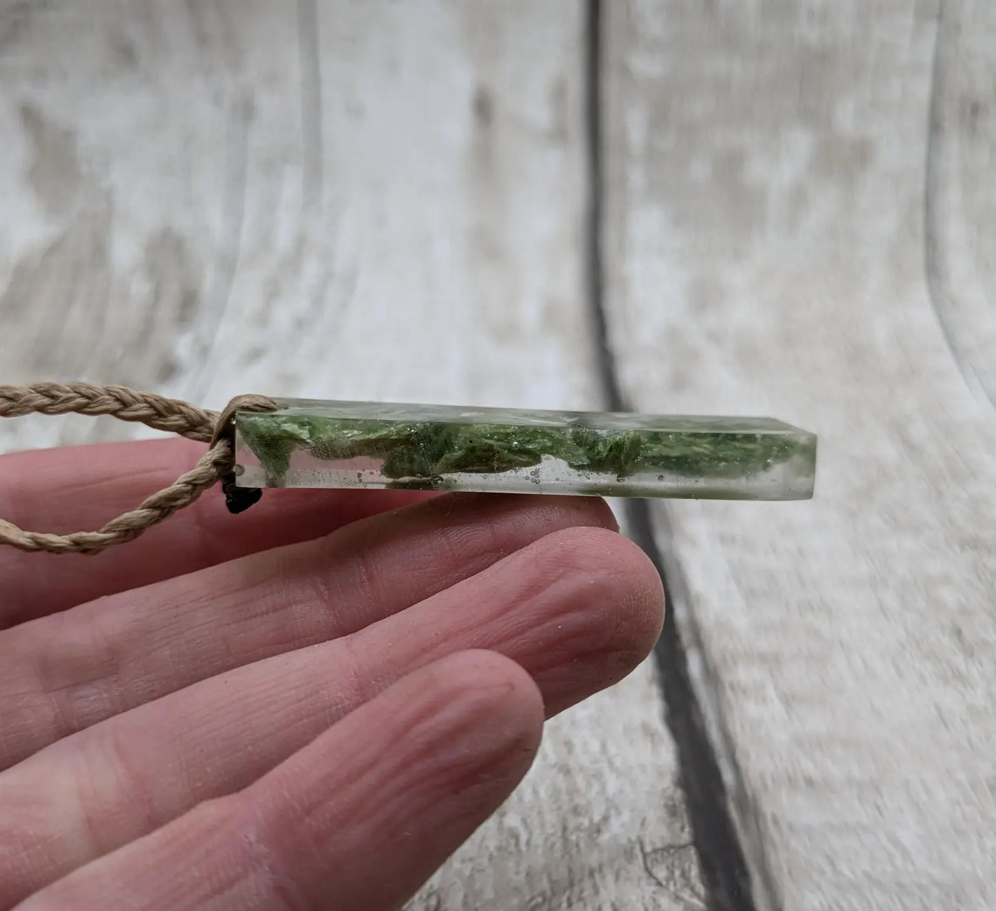 Alaskan jade in resin pendant.