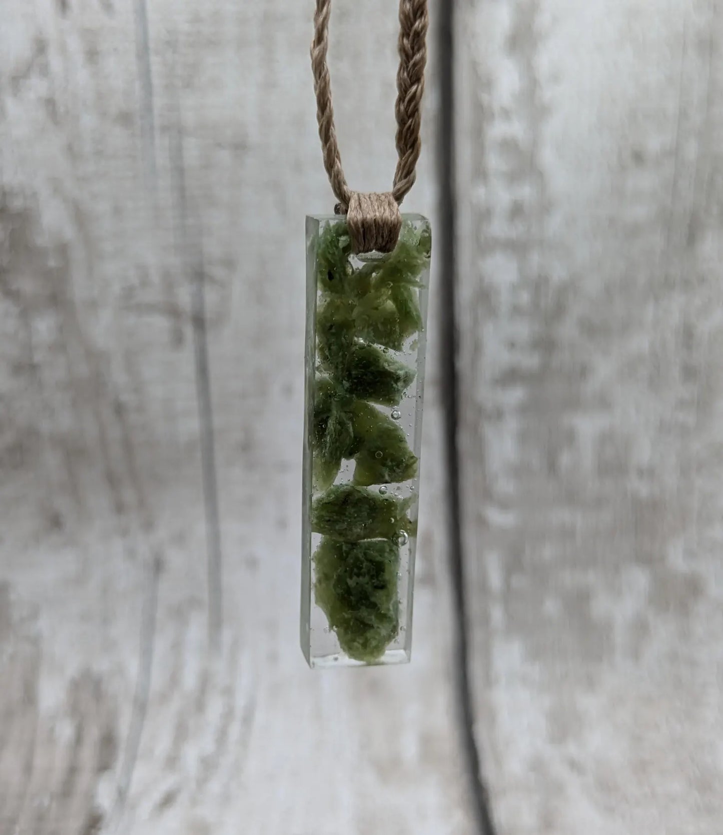 Alaskan jade in resin pendant.