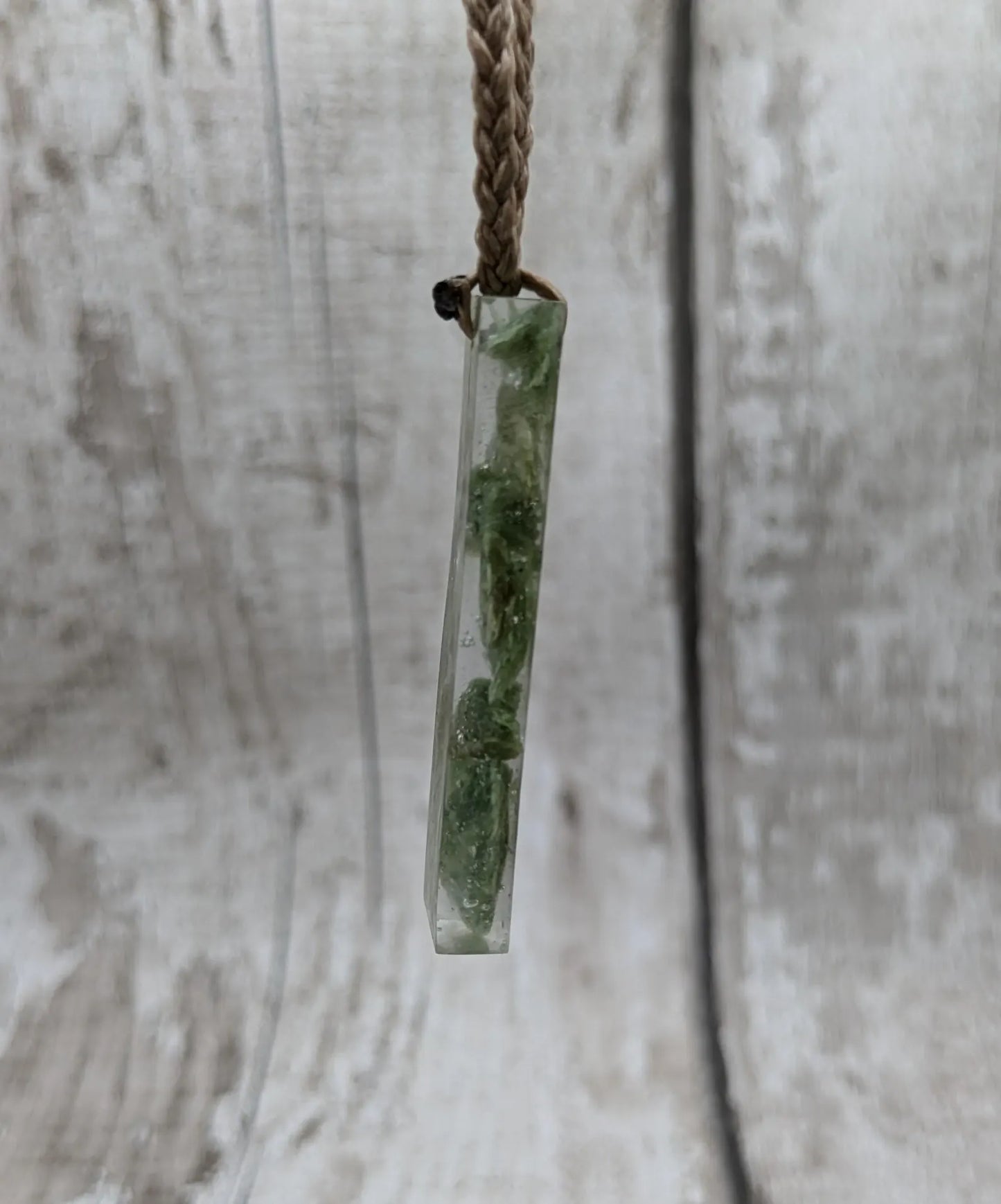 Alaskan jade in resin pendant.