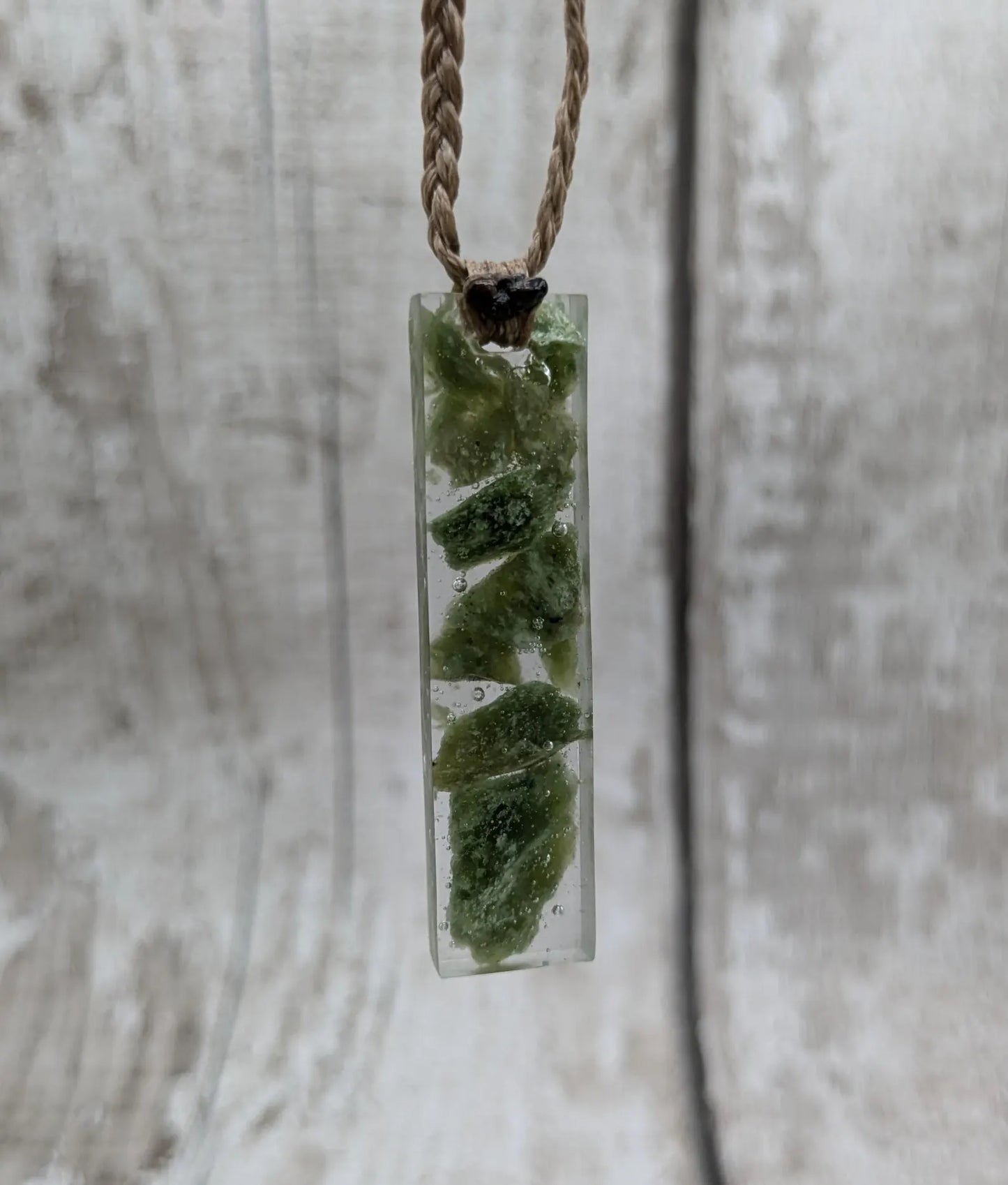 Alaskan jade in resin pendant.