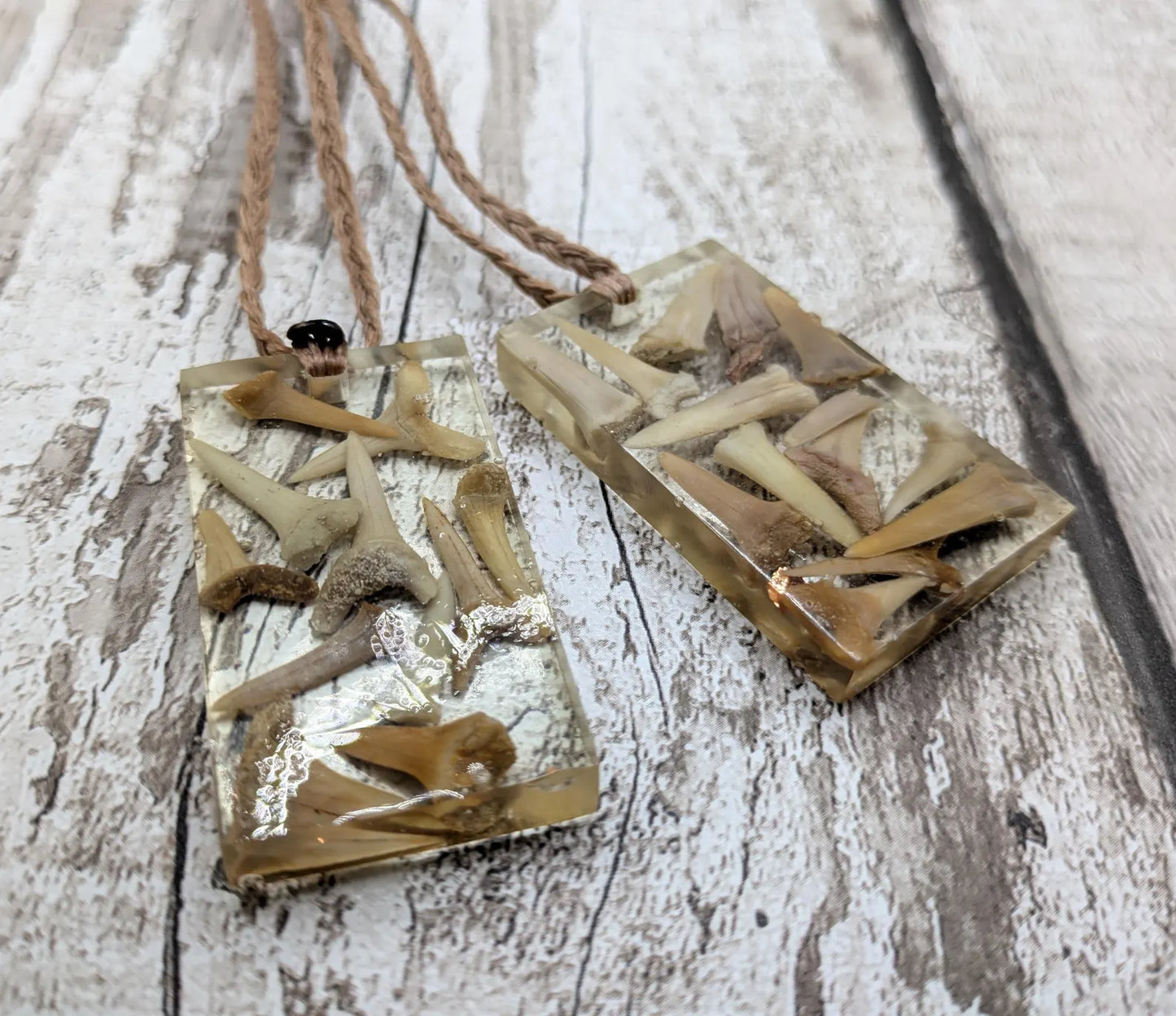 Fossilised sharks tooth in resin Christmas decoration.
