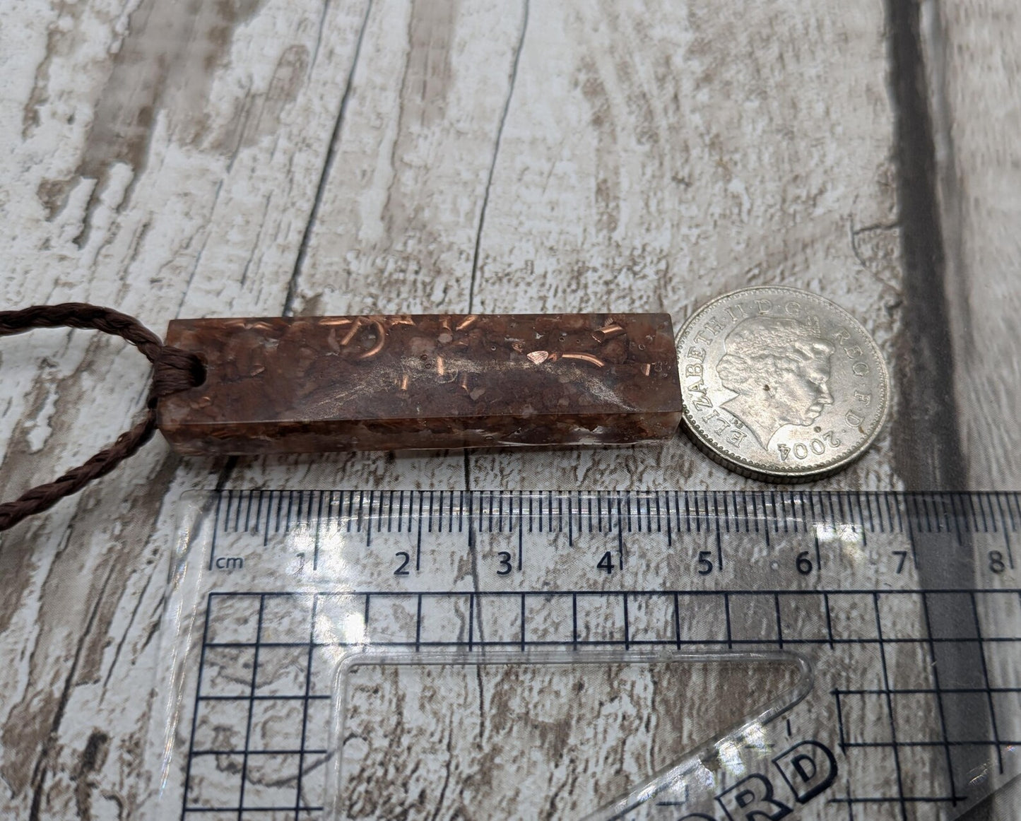 Argonite Sputnik with copper in resin.