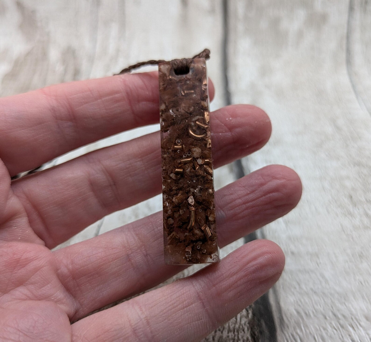 Argonite Sputnik with copper in resin.