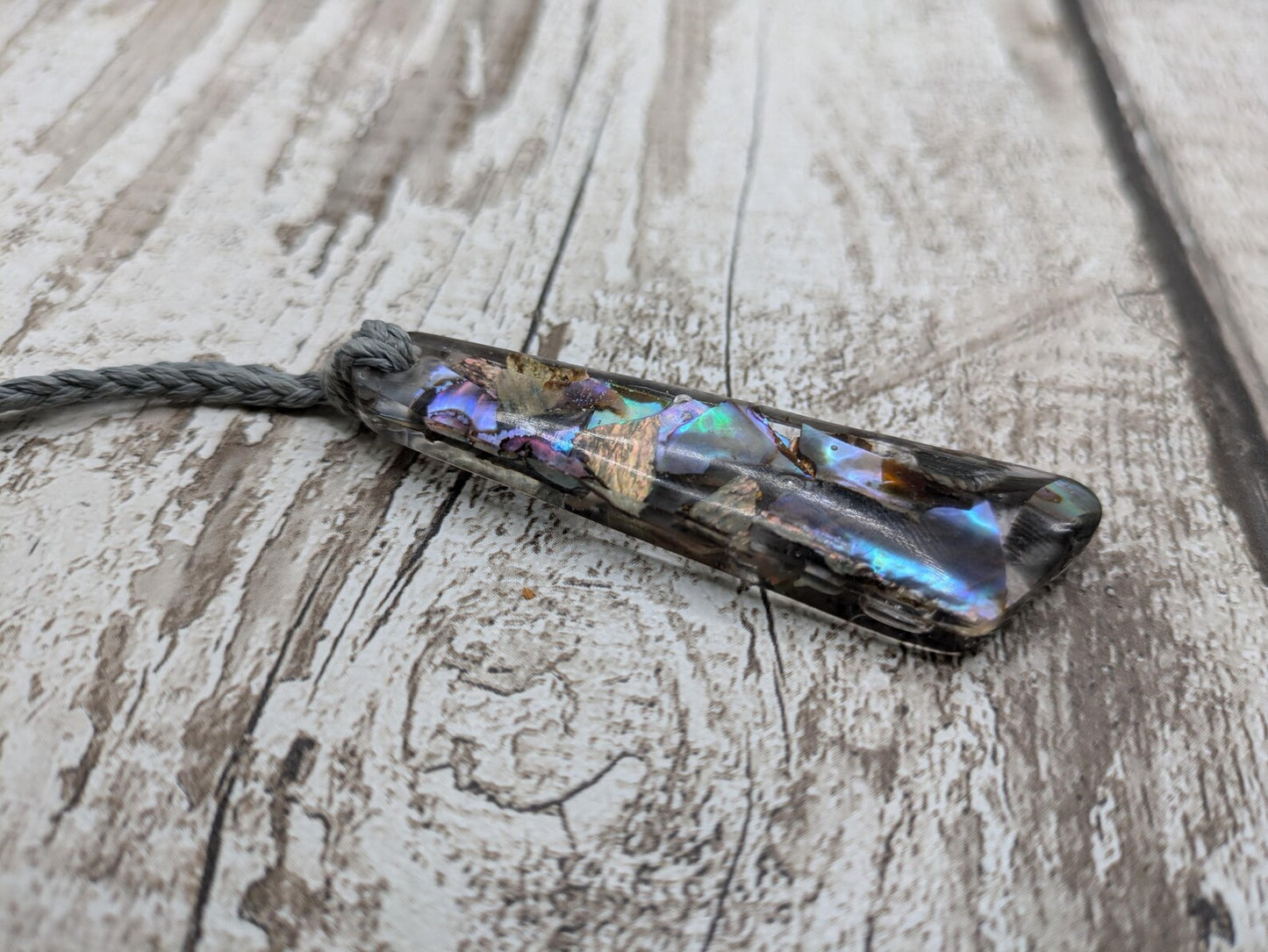 New Zealand rainbow pāua shell hanging decoration.