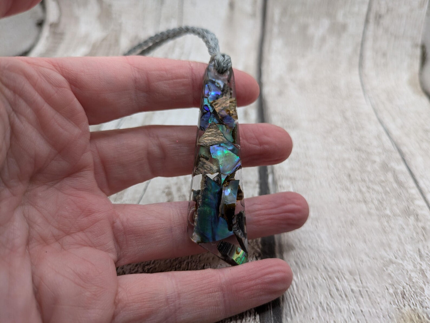 New Zealand rainbow pāua shell hanging decoration.