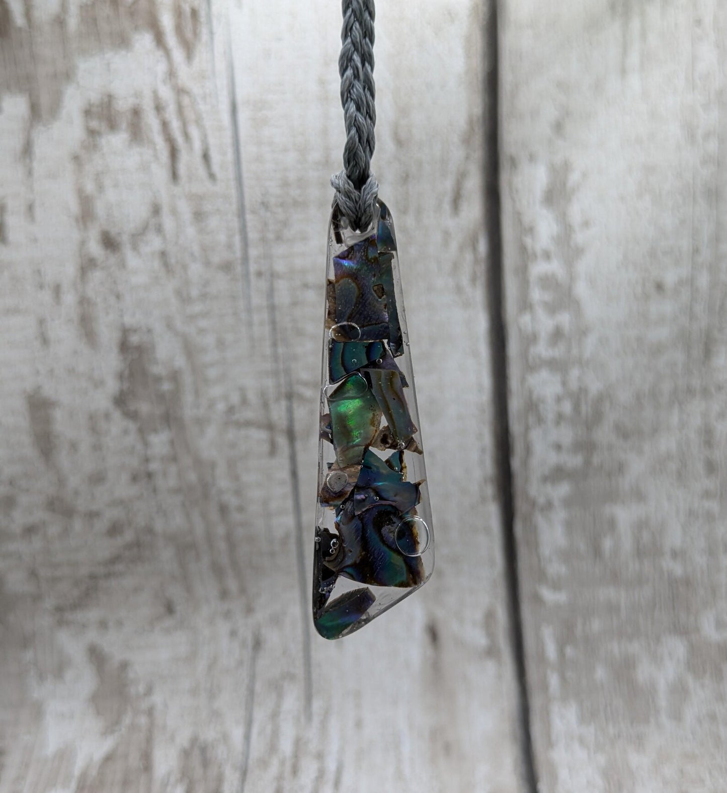 New Zealand rainbow pāua shell hanging decoration.