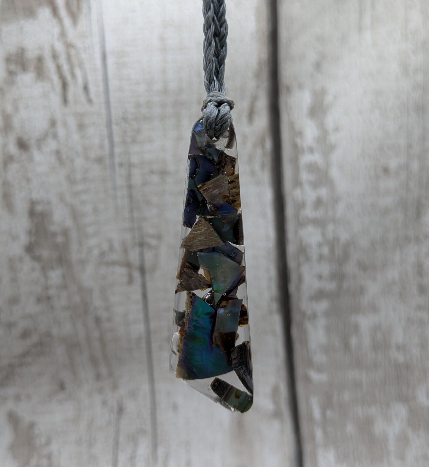 New Zealand rainbow pāua shell hanging decoration.