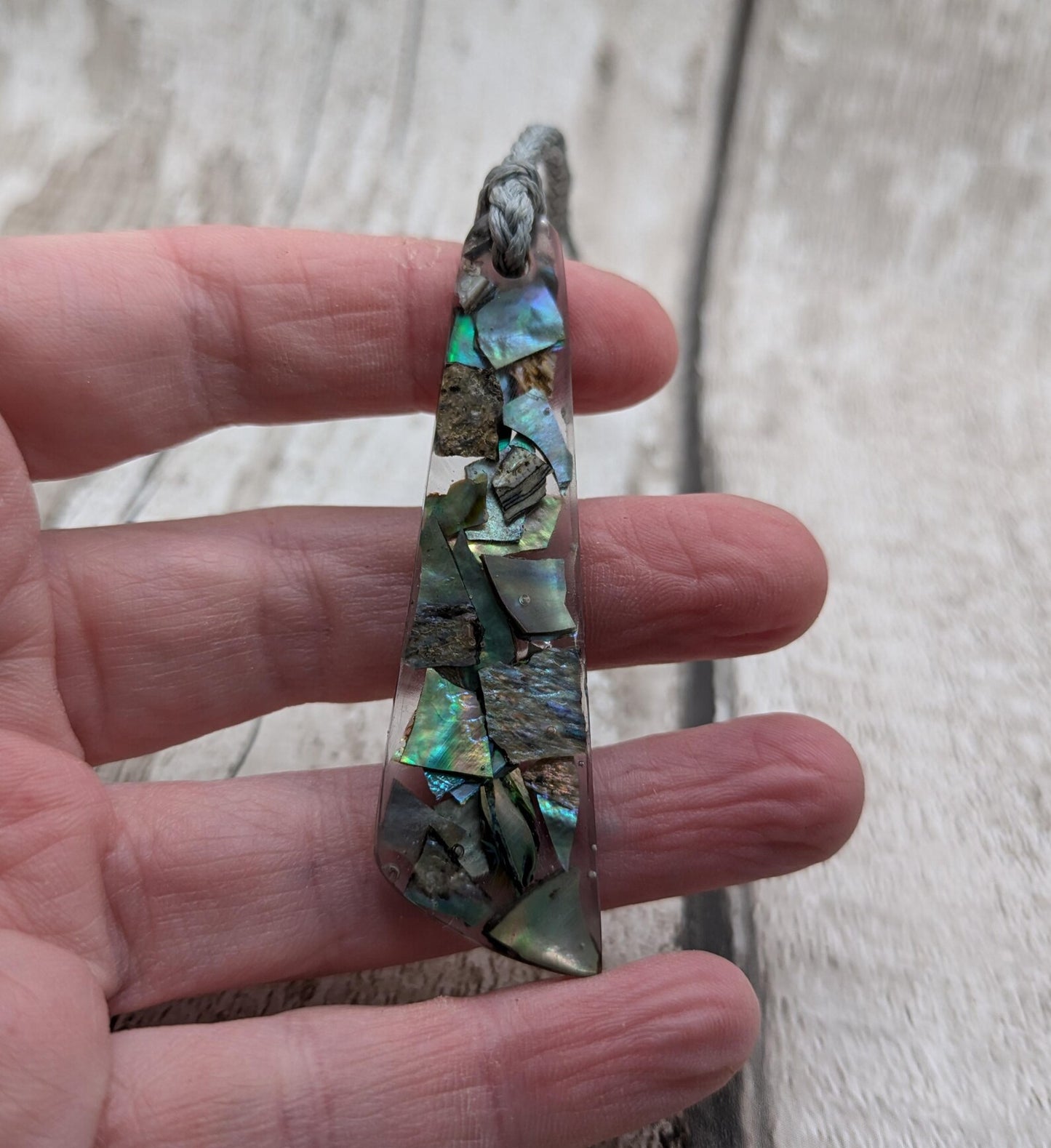 New Zealand rainbow pāua shell hanging decoration.