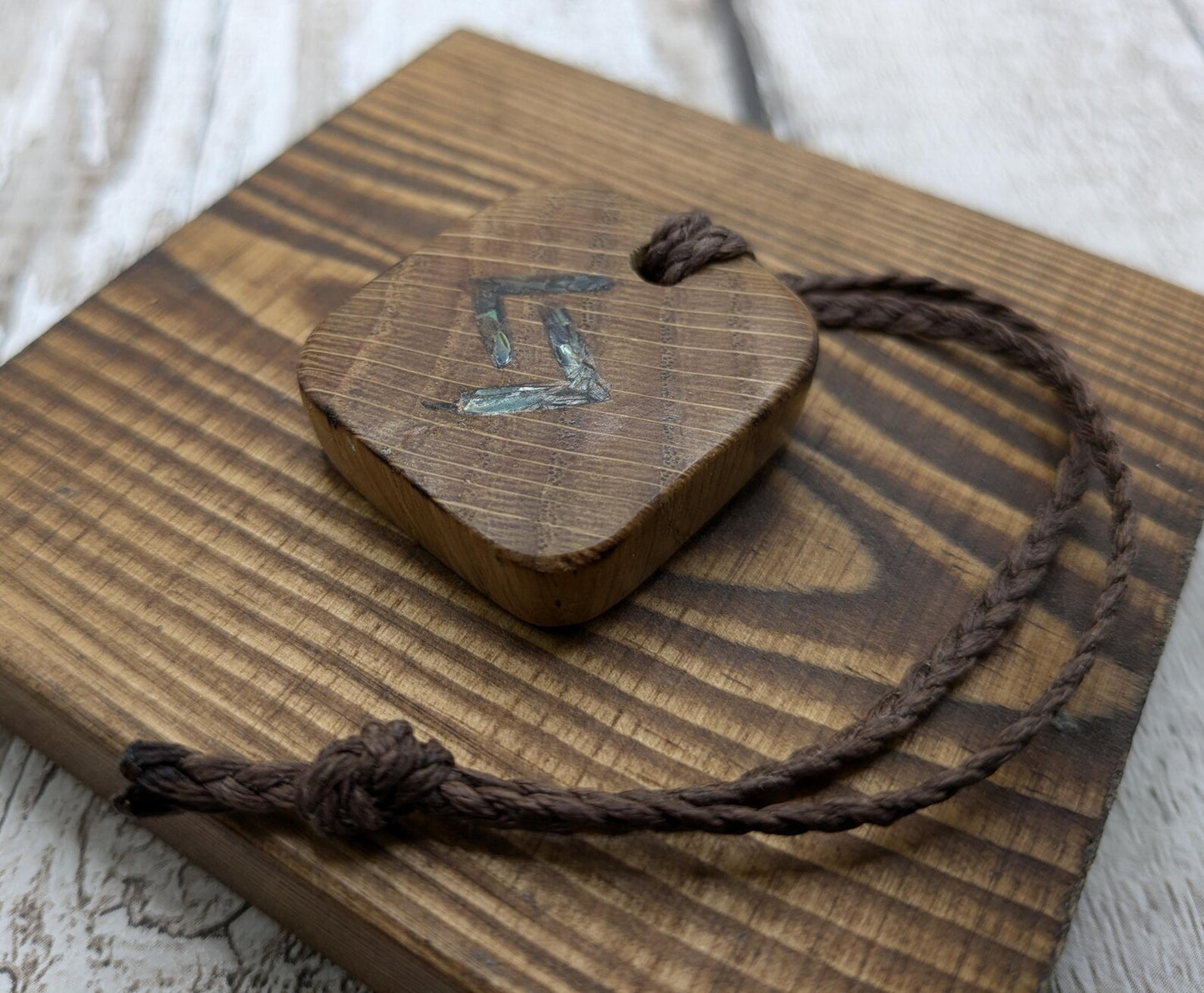 Oak wood jera Viking rune Christmas decoration with Pāua shell.
