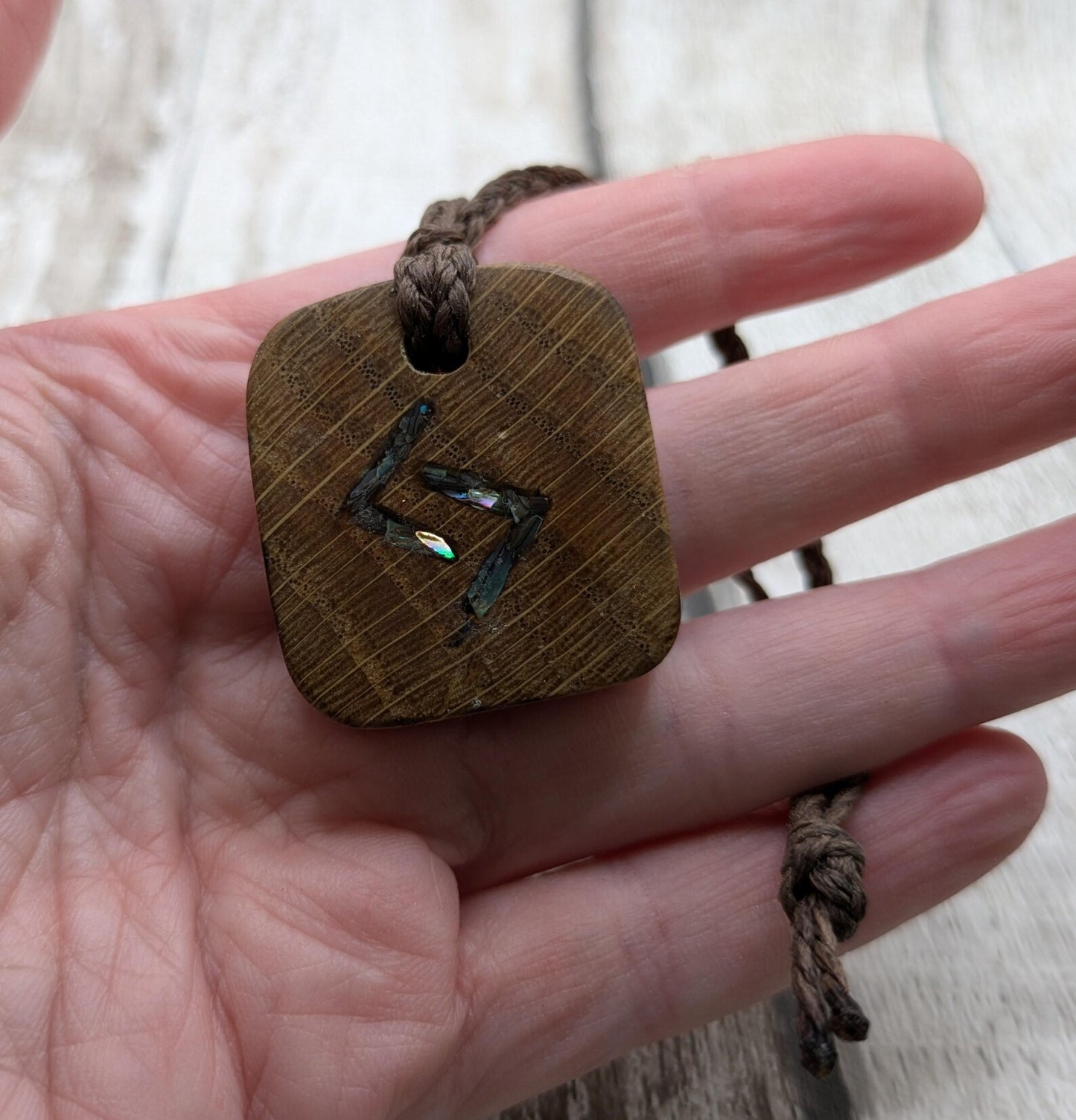 Oak wood jera Viking rune Christmas decoration with Pāua shell.