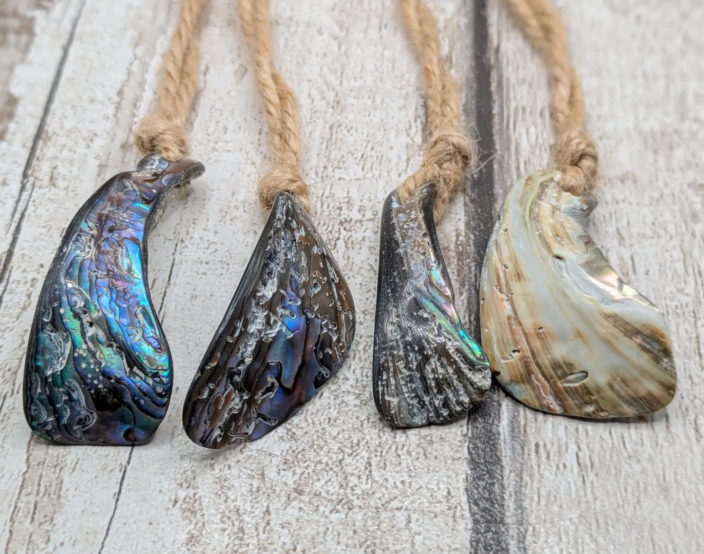 Set of Four Wild New Zealand wild Pāua Shell Ornaments – Natural Beach combed Abalone Decorations on Jute Cord for Yule for Christmas trees.