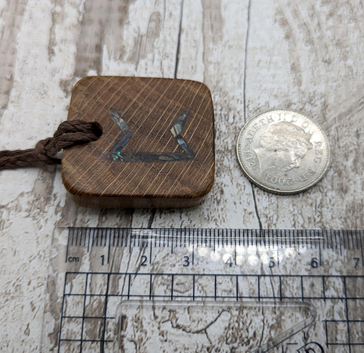 Perthro oak wood rune Christmas decoration with Pāua shell inlay.