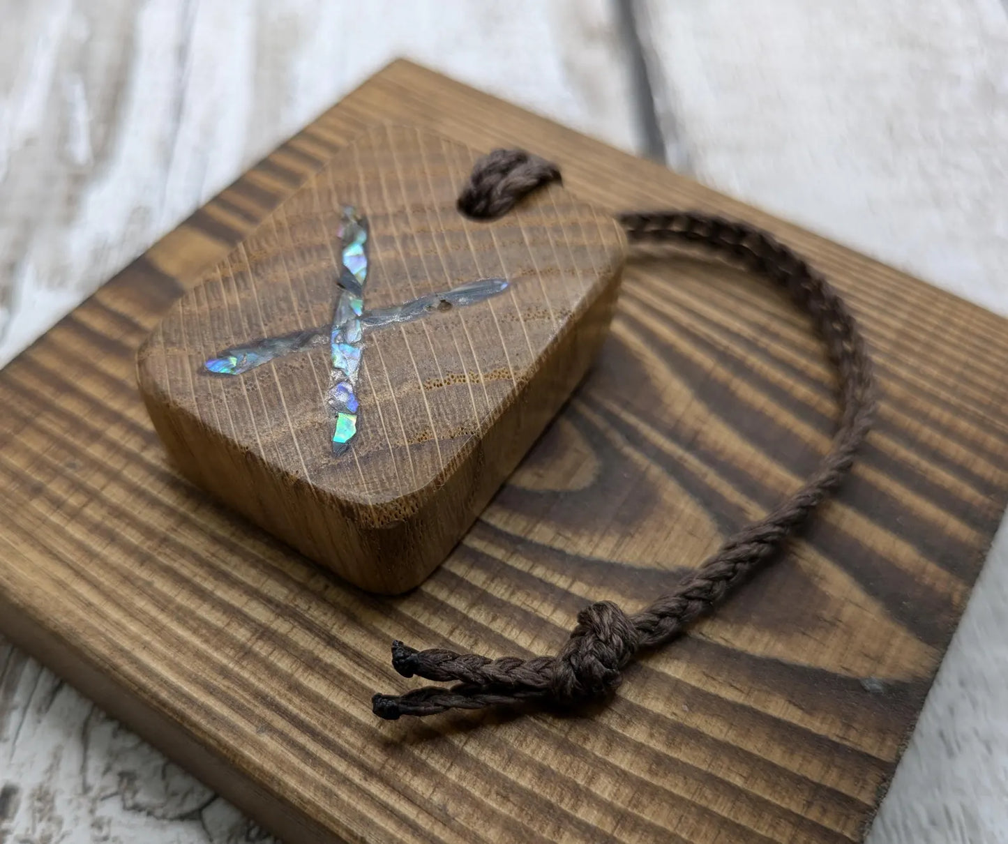 Oak wood gebo rune Christmas decoration with Pāua shell.