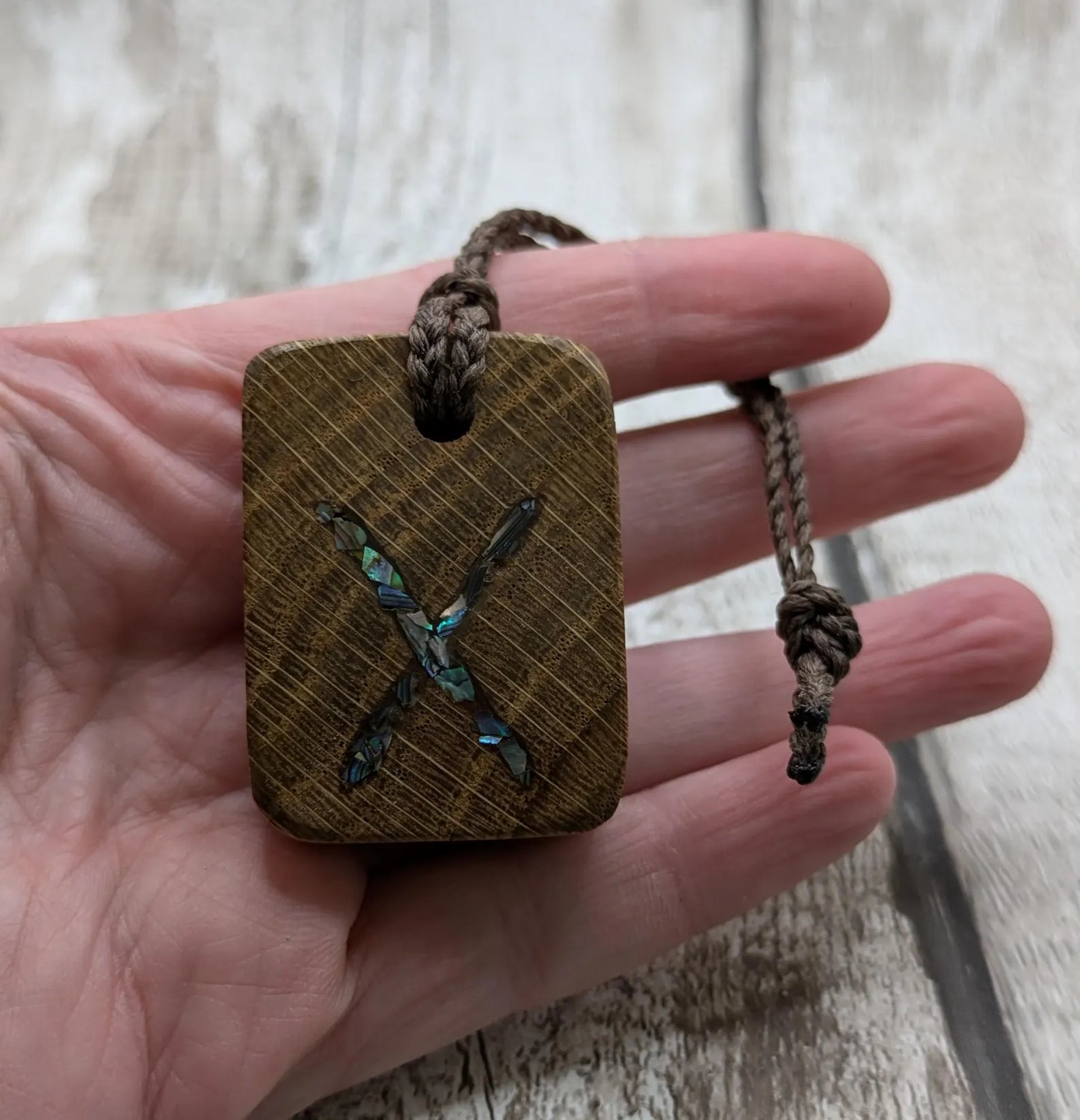 Oak wood gebo rune Christmas decoration with Pāua shell.