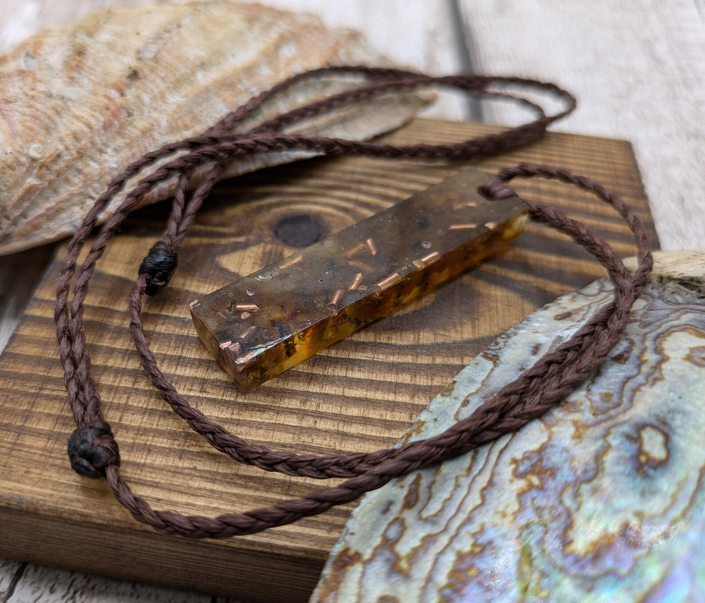 Baltic Amber and copper in resin pendant.