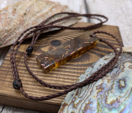 Baltic Amber and copper in resin pendant.