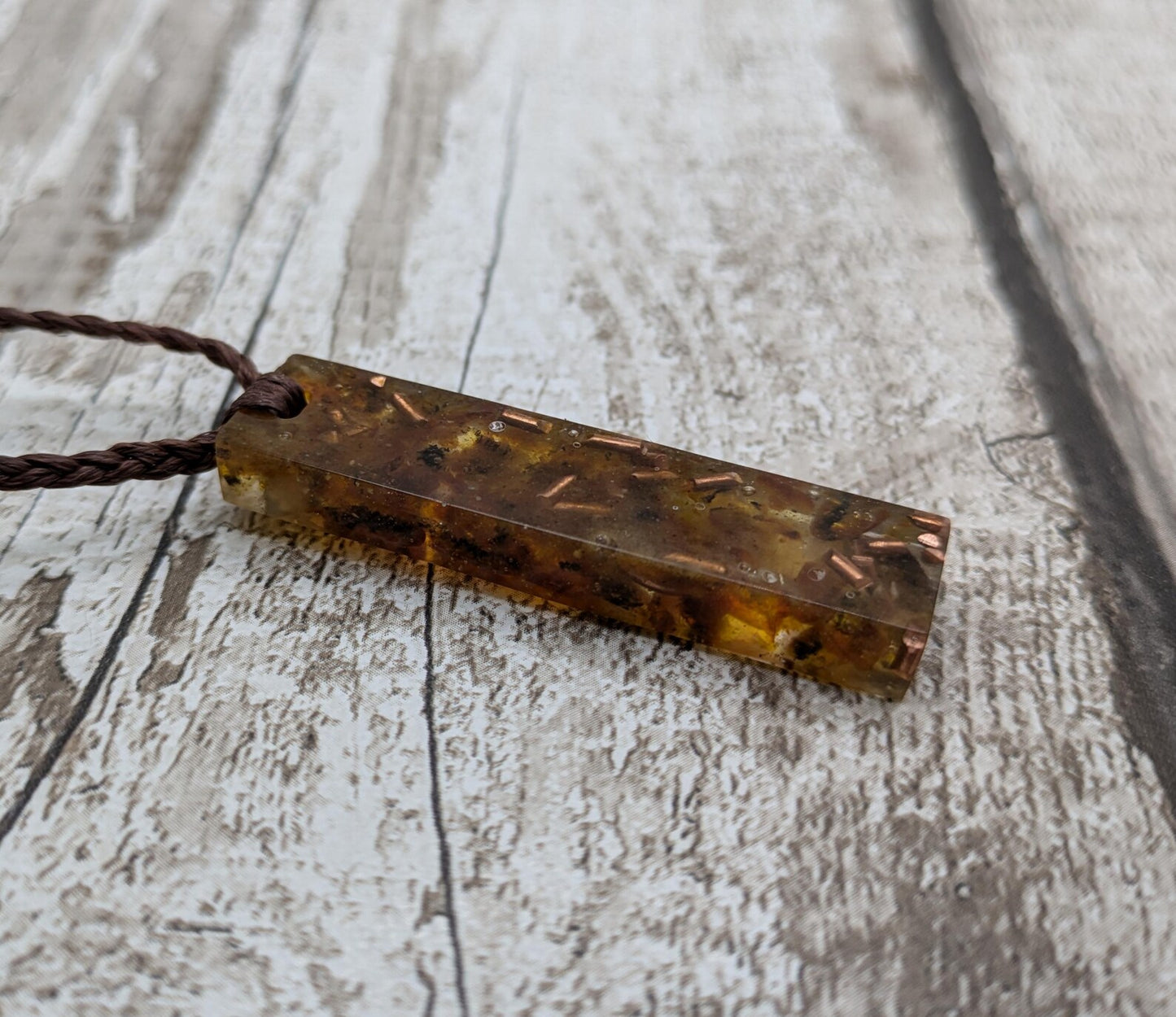 Baltic Amber and copper in resin pendant.