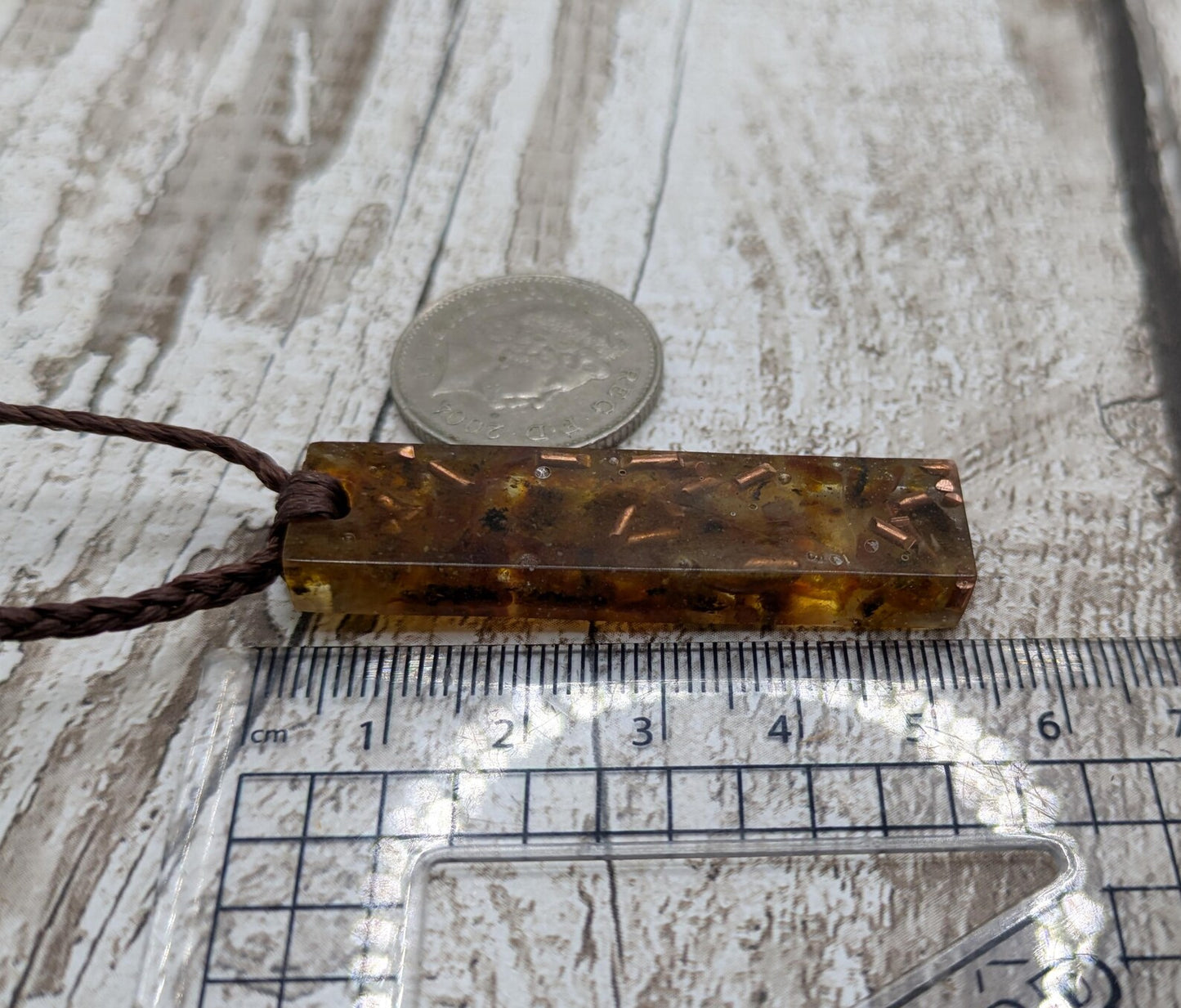 Baltic Amber and copper in resin pendant.