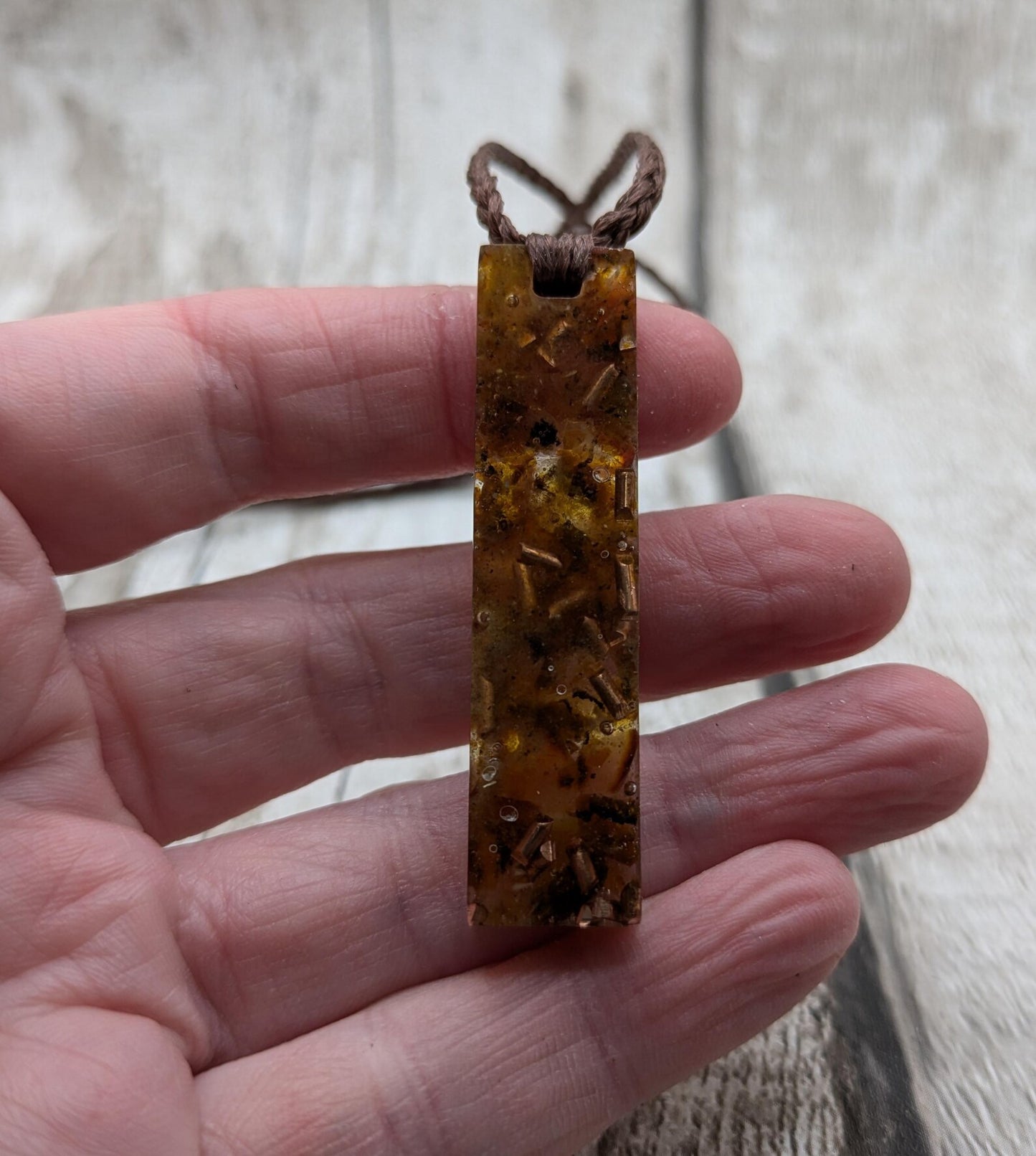 Baltic Amber and copper in resin pendant.